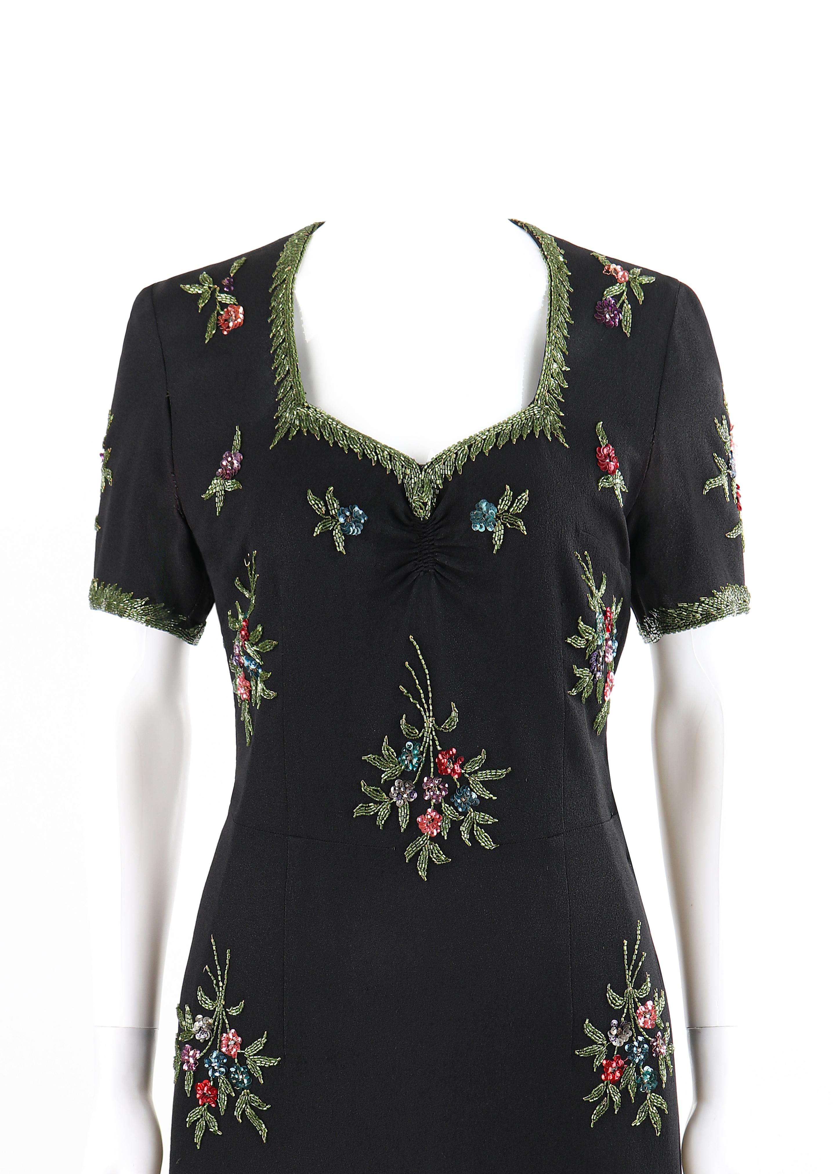 Couture c. 1940’s Black Multicolor Floral Glass Bead Embroidered Shift Dress
 
Circa: 1940’s 
Style: Shift dress
Color(s): Shades of black (body), blue, pink, purple, and green (beads)
Lined: No
Unmarked Fabric Content (feel of): Rayon crepe; glass