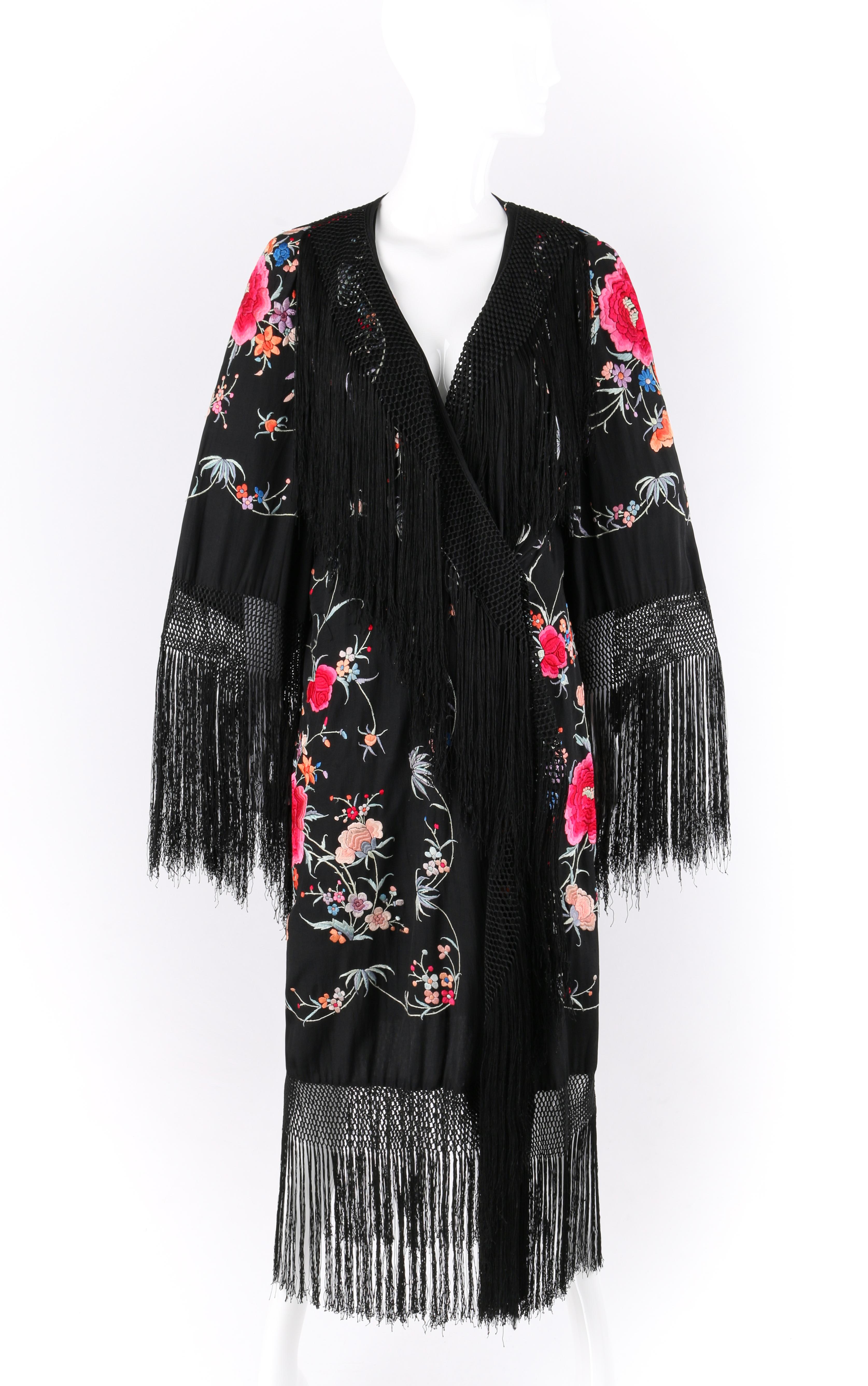 COUTURE c.1920’s Black Hand Embroidered Silk Oriental Floral Fringe Kimono Robe
Circa: 1920’s
Style: Kimono
Color(s): Black (base); shades of orange, pink, green, purple, and blue (detail)
Lined: No
Unmarked Fabric Content (feel of): Raw silk,