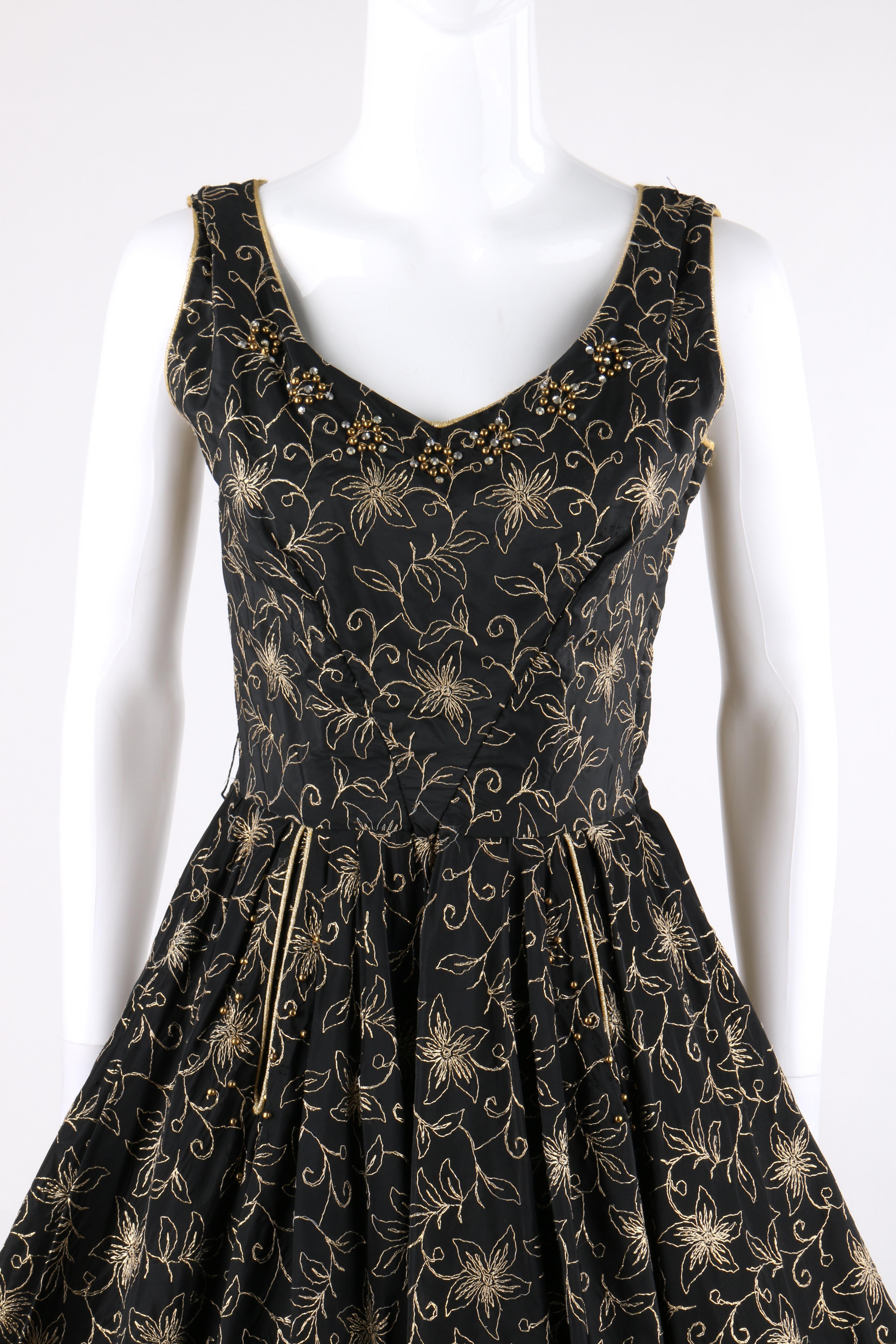 COUTURE c.1950’s Black Gold Floral Rhinestone Embellished Beaded Fit n Flare Party Dress 

ONE OF A KIND!

Circa: 1950’s
Style: Fit n Flare dress
Color(s): Shades of black and gold
Lined: Partial
Unmarked Fabric Content (feel of): Taffeta; metal