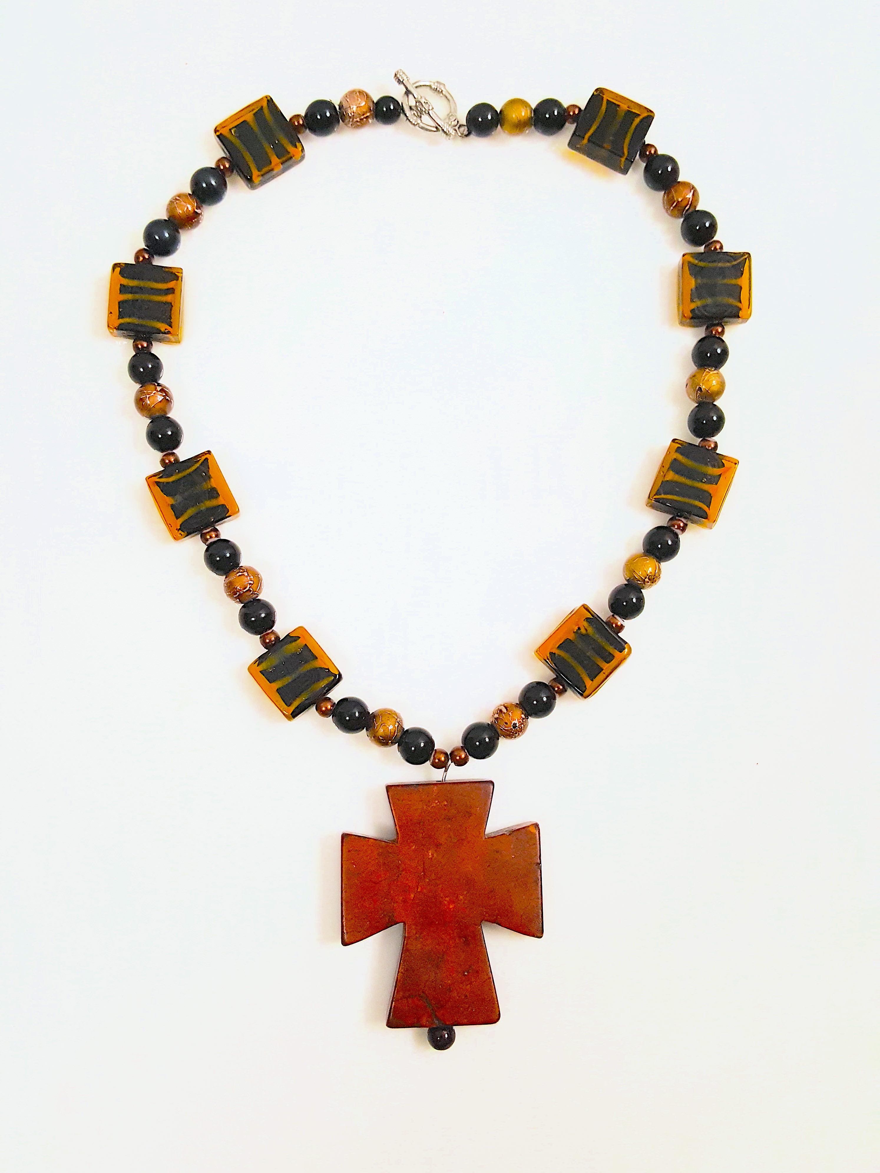 Characteristic of the large chunky shapes including Byzantine-style crosses favored by French couturiers Gabriel 