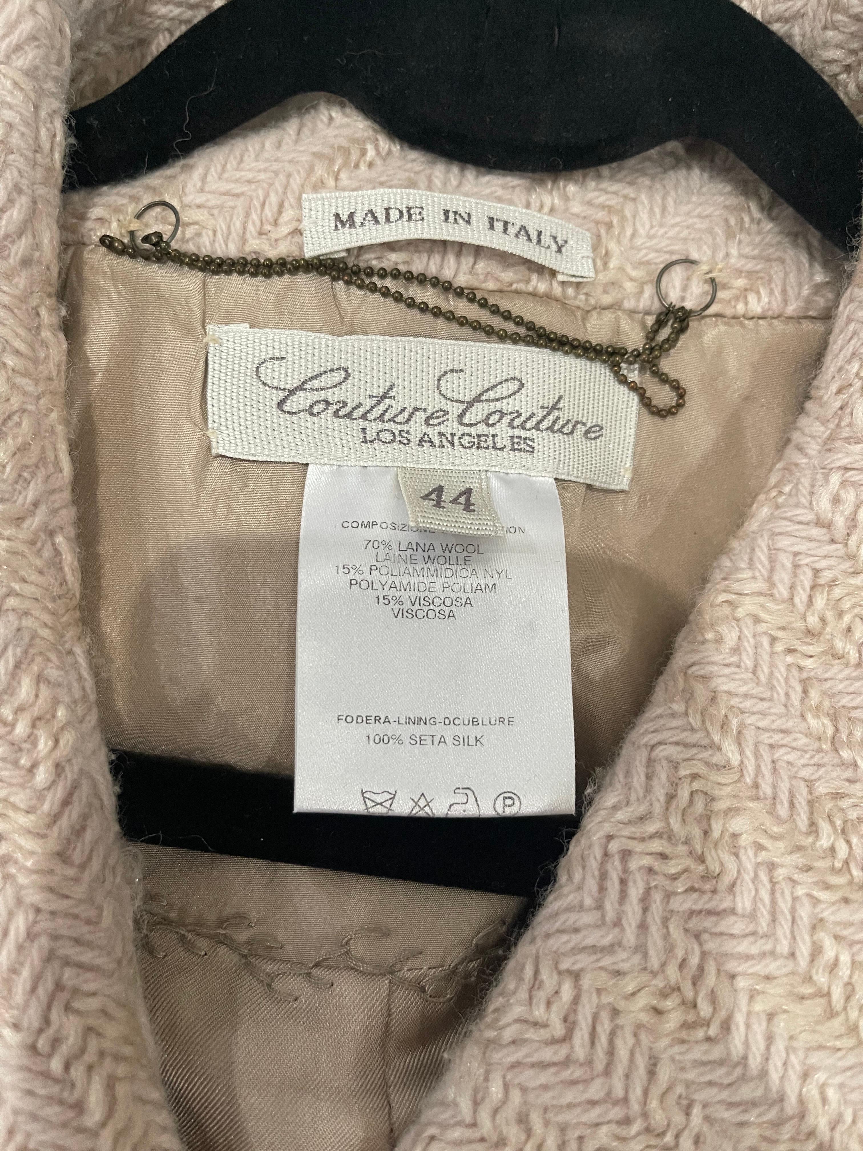 Chic never worn Couture Couture Los Angeles ivory / off white jacket ! Features a soft wool and rayon blend. Four snaps up the front with two fabric covered oak buttons. Pockets at each side of the waist. Lined in a beautiful flower printed silk.