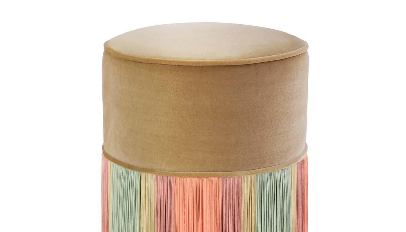 Exuding a blooming sense of lightness, this light-colored, Art Deco-inspired ottoman will be a unique and elegant accent to a sophisticated interior. Its luminous beige velvet cushion strikingly contrasts with the sides, adorned with light pink,