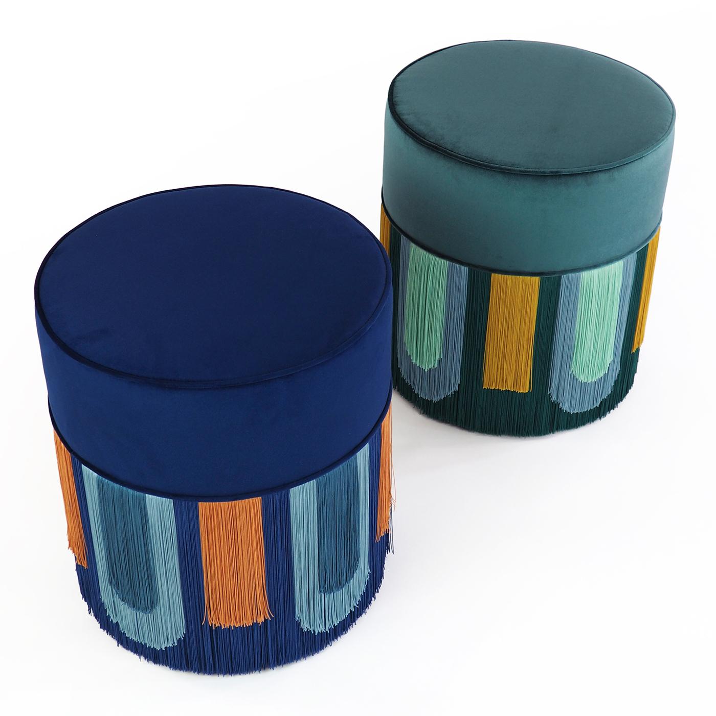 Part of a series of elegant ottomans inspired by the luxurious flair of Art Deco style, this ottoman will be a precious addition to a modern interior, providing extra seating or a stylish footrest. Luxurious velvet fabric defines the piece, the top