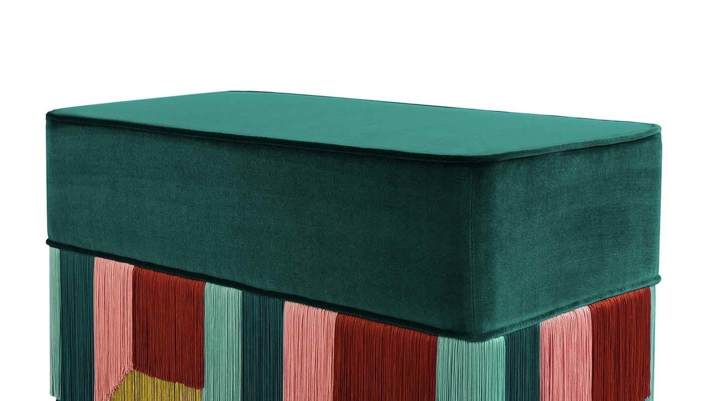 The modern sensibility of Bozzoli's designs characterizes her collection of ottomans and benches, presented at Milan Design Week in 2019. The sense of modernity is given by her use of vibrant colors and geometric shapes. Hanging from an emerald