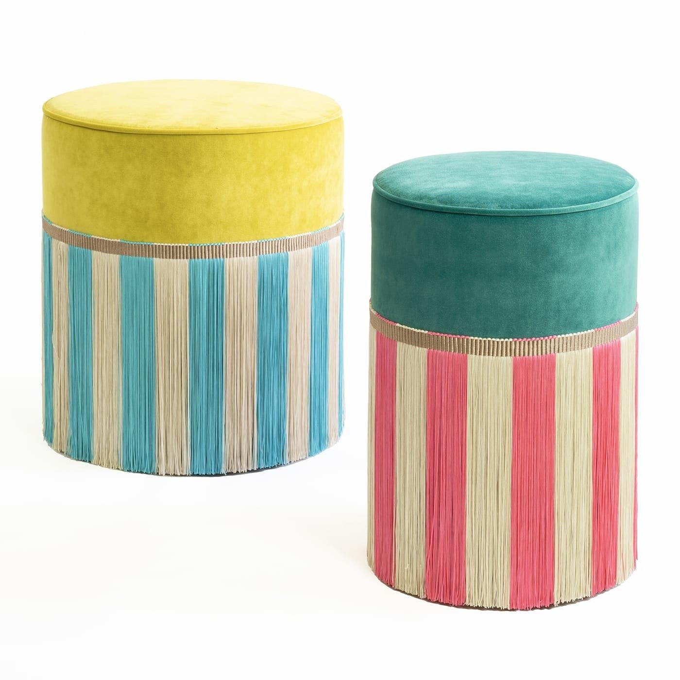 Lively and stylish, this cylindrical ottoman is a stunning piece sure to perk up otherwise dull corners of modern homes. Viscose fringes outline a striped design where the fresh combination of turquoise and white well harmonizes with the