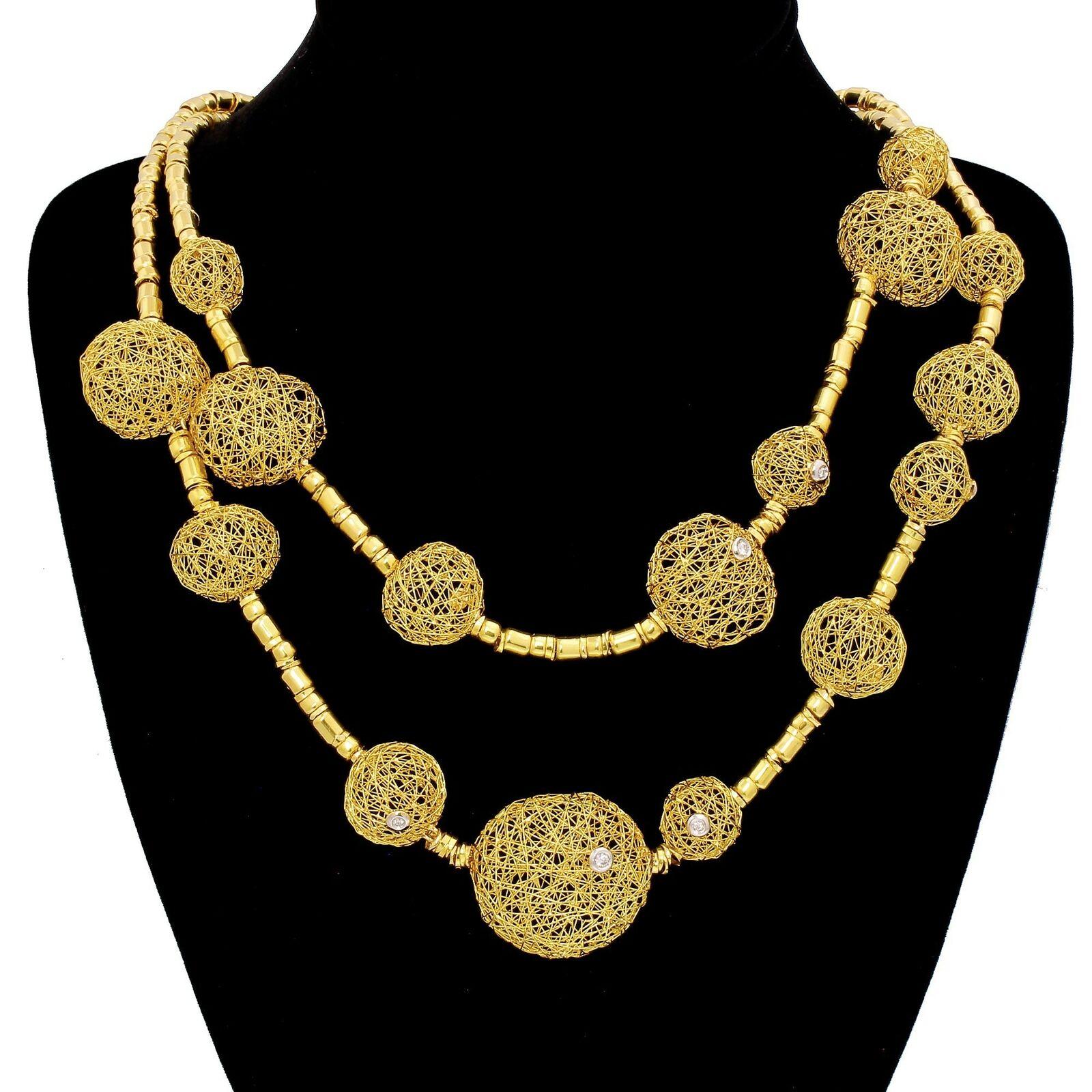 Details & Condition: Spectacular couture Orlando Orlandini Atelier 18kt Gold and diamond double row necklace from Italy.
This amazing necklace has been created entirely by hand, every sphere is unique, no two are ever identical and every link, chain