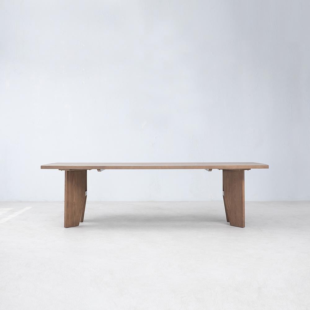Romanticizing the unique character and beauty of FSC® Certified American White Ash, the Cove Dining Table presents a stunning table top with an inverted natural live edge running along the center, connected with hand crafted traditional butterfly