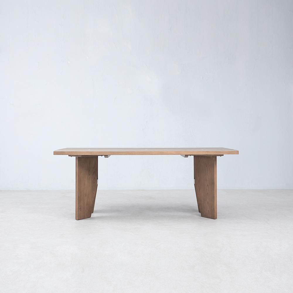 Romanticizing the unique character and beauty of FSC® Certified American White Ash, the Cove Dining Table presents a stunning table top with an inverted natural live edge running along the center, connected with hand crafted traditional butterfly