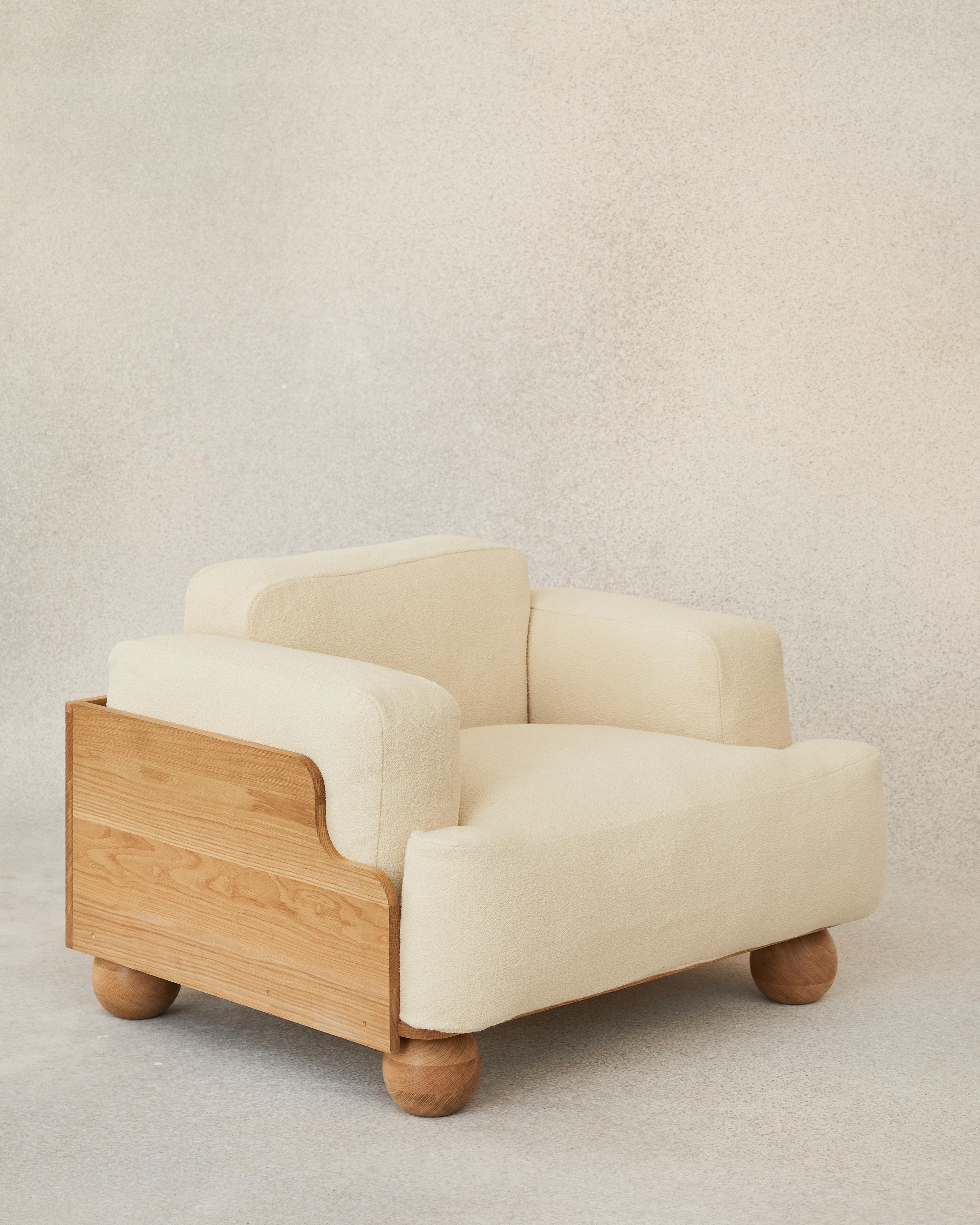 The Cove Armchair is defined by its sculptural and enveloping nature. Planes of beautifully grained oak wrap around the sides and back of the soft cushions, following the lines of their curved corners and edges.

Thick and deep seat, back and arm