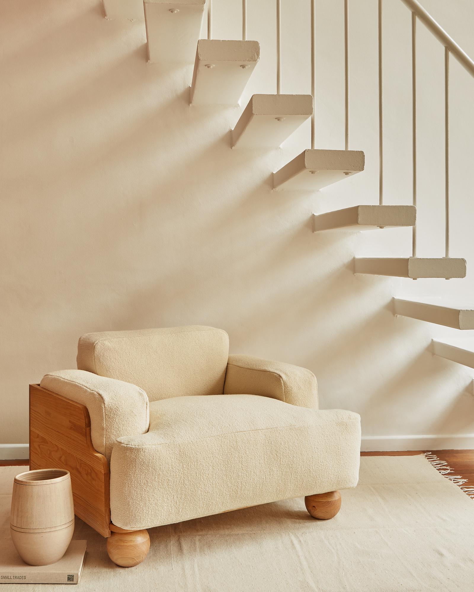 The Cove Armchair is defined by its sculptural and enveloping nature. Planes of beautifully grained oak wrap around the sides and back of the soft cushions, following the lines of their curved corners and edges.

Thick and deep seat, back and arm