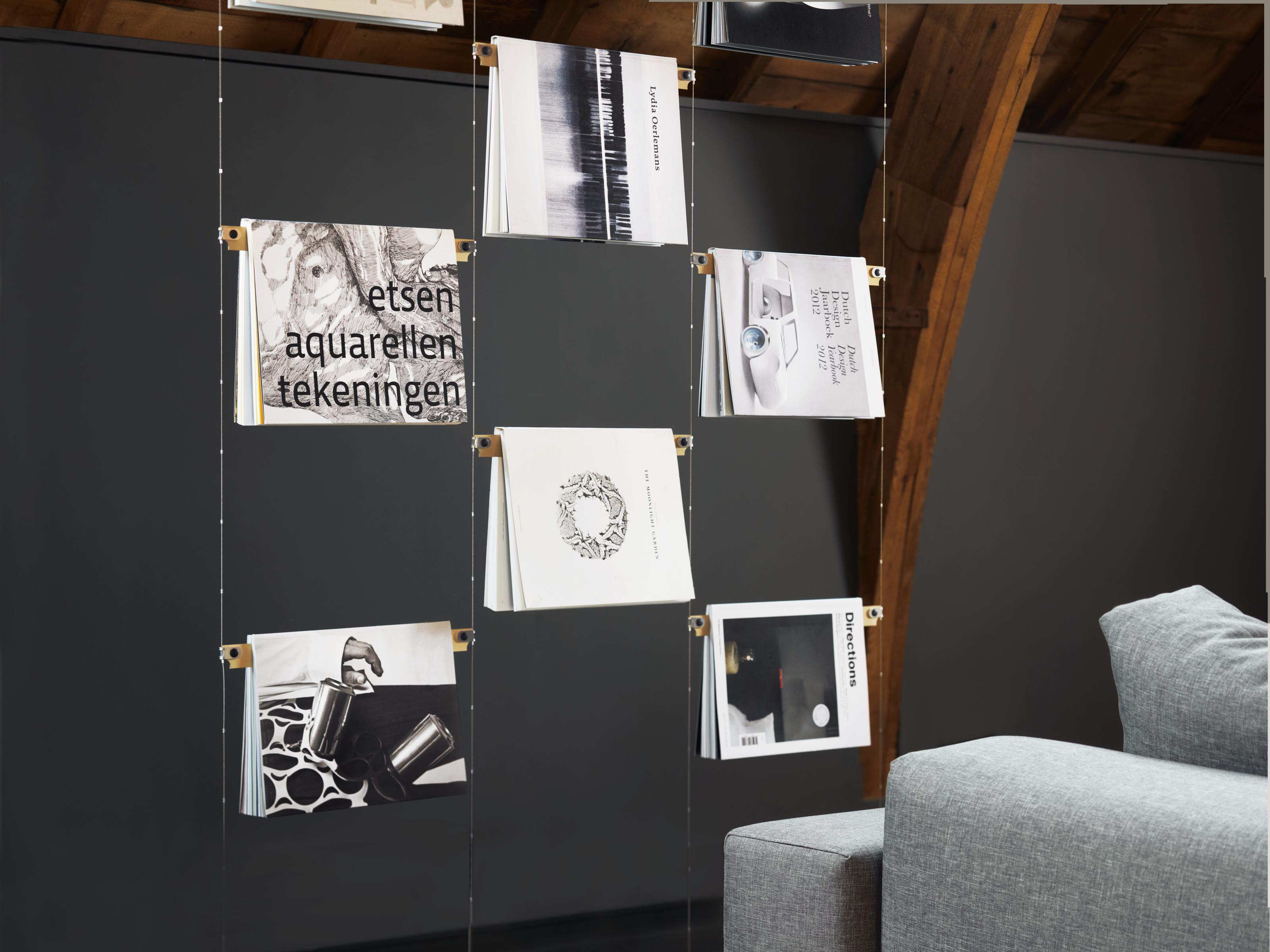 Please note the price is calculated for a set of (4 lines + 18 rulers) as in the images.

Cover curtain, a spatial room divider meets a bookshelf. Showcasing your favorite book covers as a rhythmic mood board in space. Cover curtain works as an