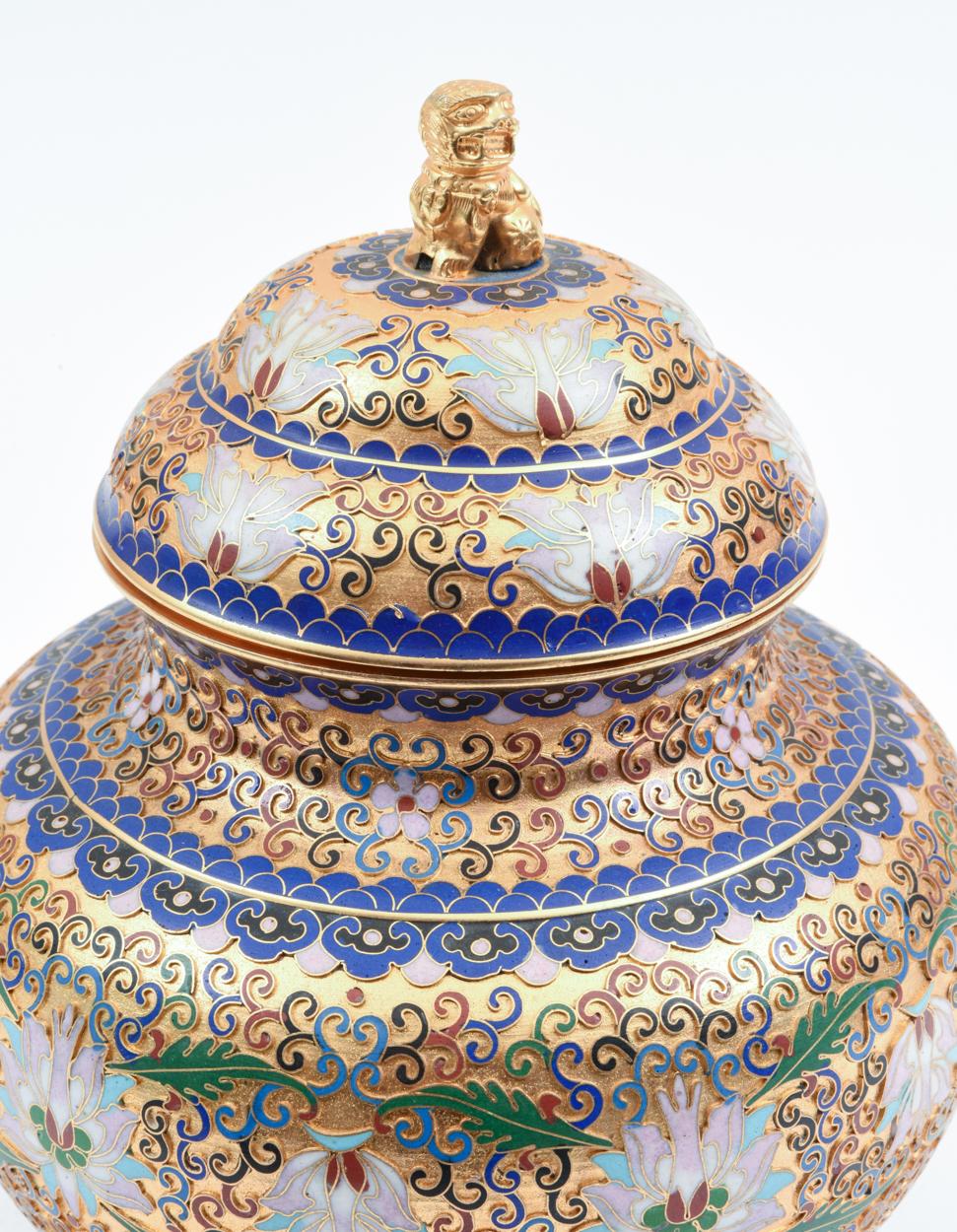 Mid-20th century gilded design details covered decorative urn / piece. The piece is in excellent vintage condition. The covered urn measure about 10 inches high X 9 inches diameter.
