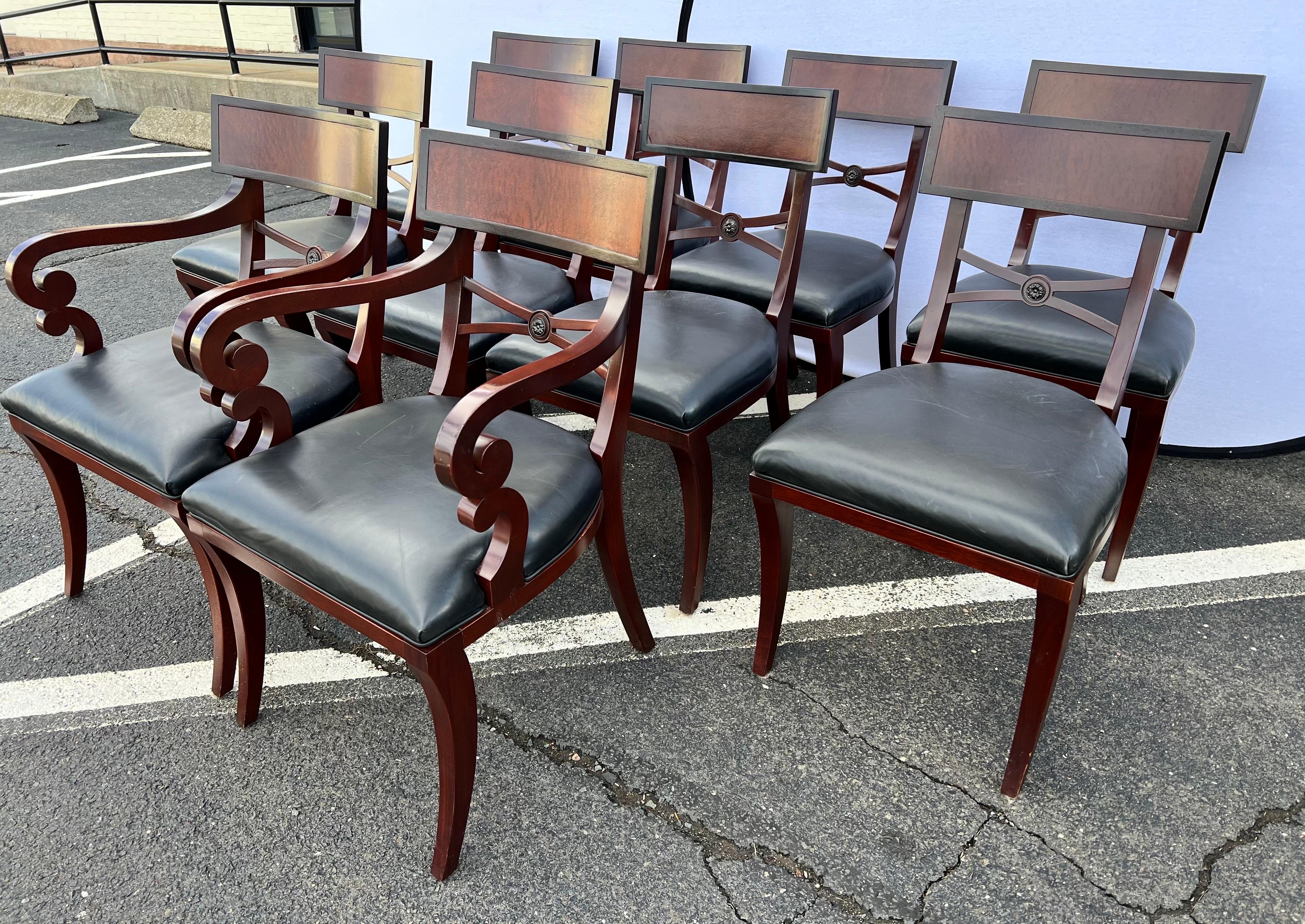 Coveted and exceptional, set of ten (10) mahogany and leather Klismos dining chairs by Baker Furniture, circa late 20th Century. This design is routinely attributed to the esteemed Michael Taylor. Expertly crafted solid mahogany construction with