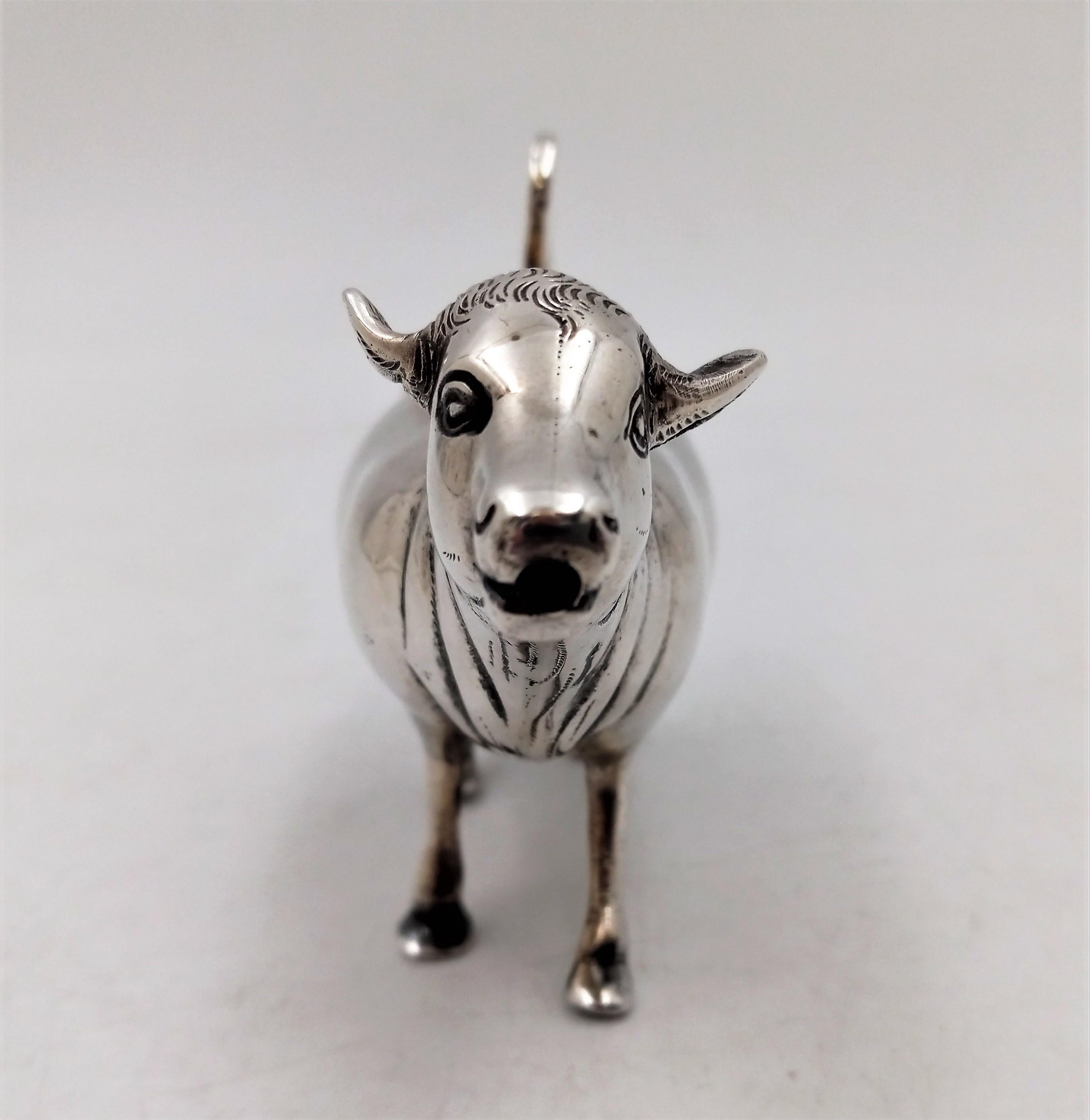 antique cow creamer dispenser