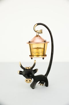 Cow Figurine Holding a Thermometer by Walter Bosse