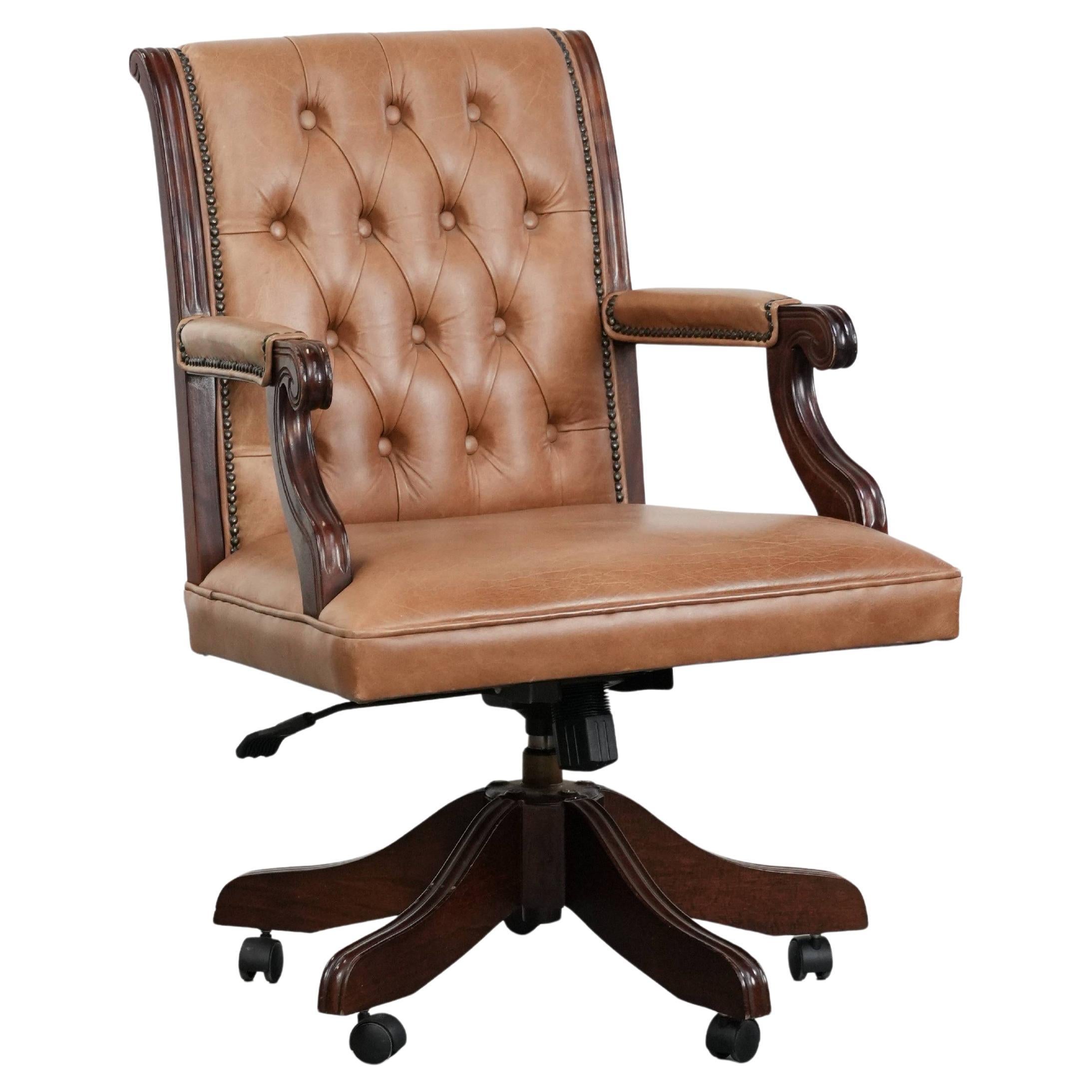 Cow leather and wood Chesterfield office chair in English style on wheels