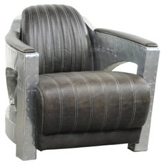 Cow leather aviator design armchair finished with aluminium and rivets