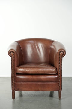 Sillón club de cuero de vaca en bonito color coñac oscuro de estilo inglés