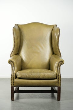 Cow leather wingback armchair in a classic English country house style