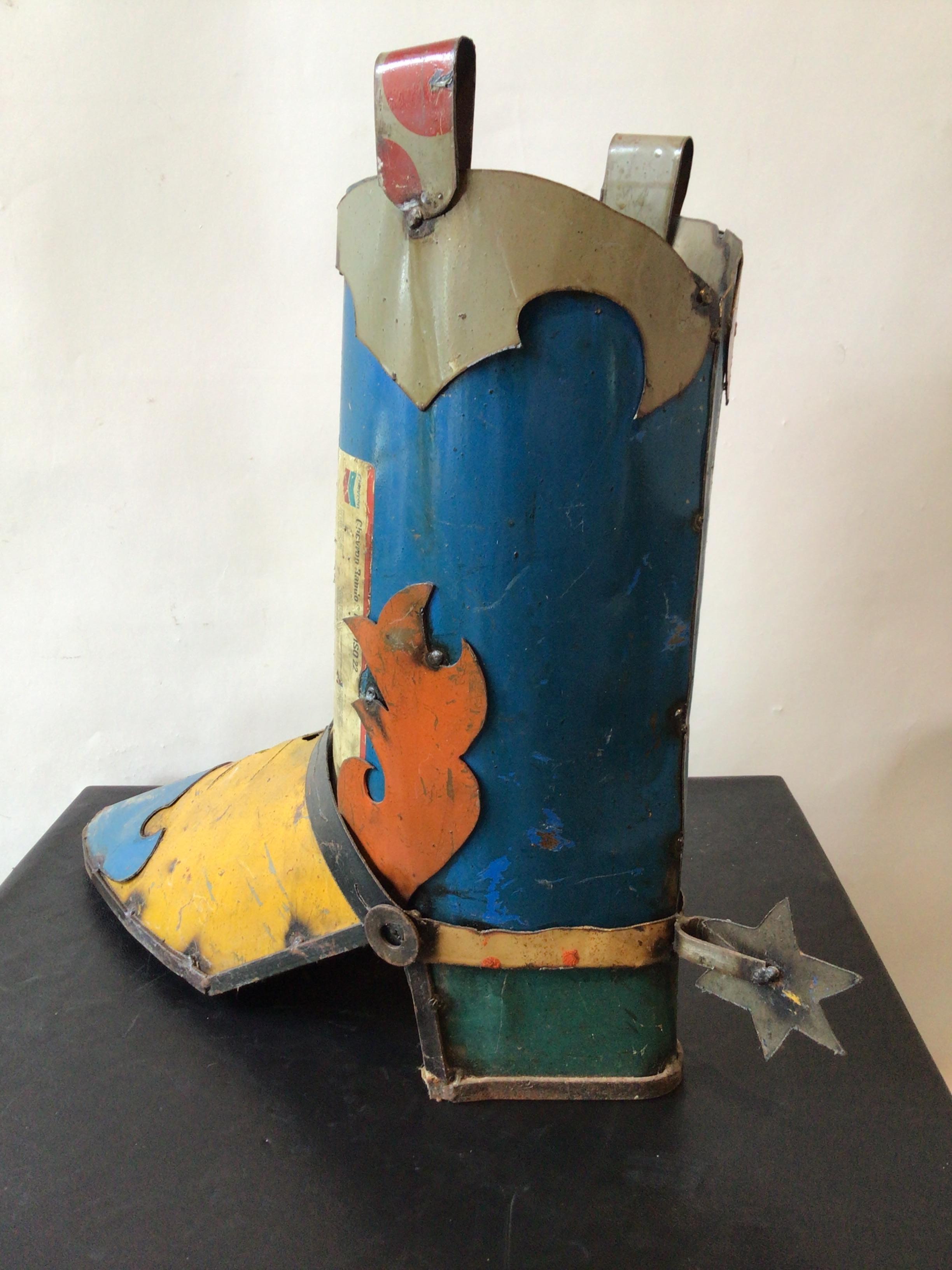 Cowboy boot umbrella stand made from steel from auto parts.