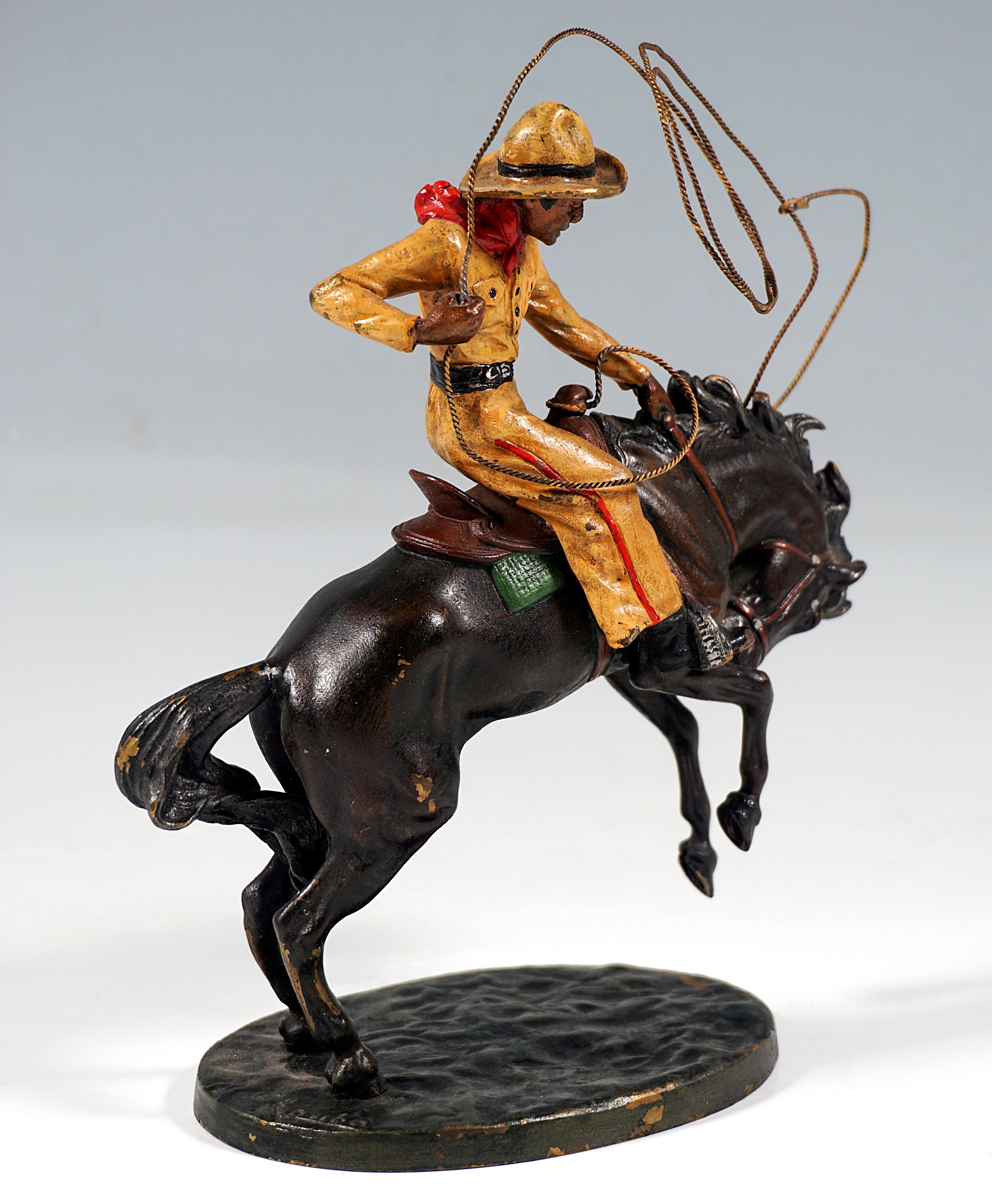 Excellent piece of Viennese Bronze Art around 1920
Cowboy in typical work clothes - shirt, baggy pants, bandana and cowboy hat - on bucking horse, holding in one hand the lasso attached to saddle and twirling high above the horse's head, the reins