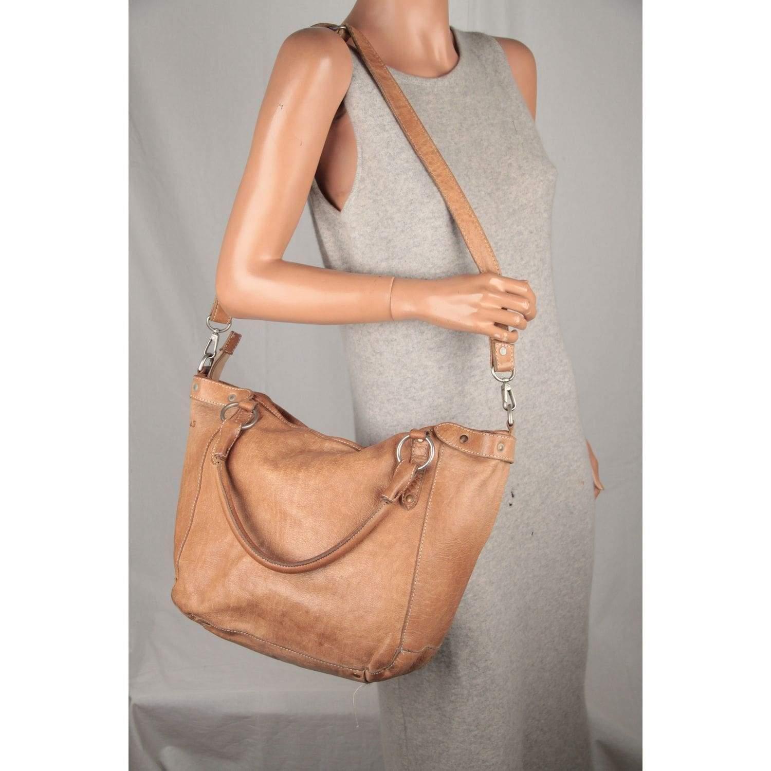 MATERIAL: Leather COLOR: Tan MODEL: GENDER: Womens SIZE: CONDITION RATING: B :GOOD CONDITION - Some light wear of use CONDITION DETAILS: Some scratches and creases on leather due to normal use, some darkness and pen marks MEASUREMENTS: BAG HEIGHT: