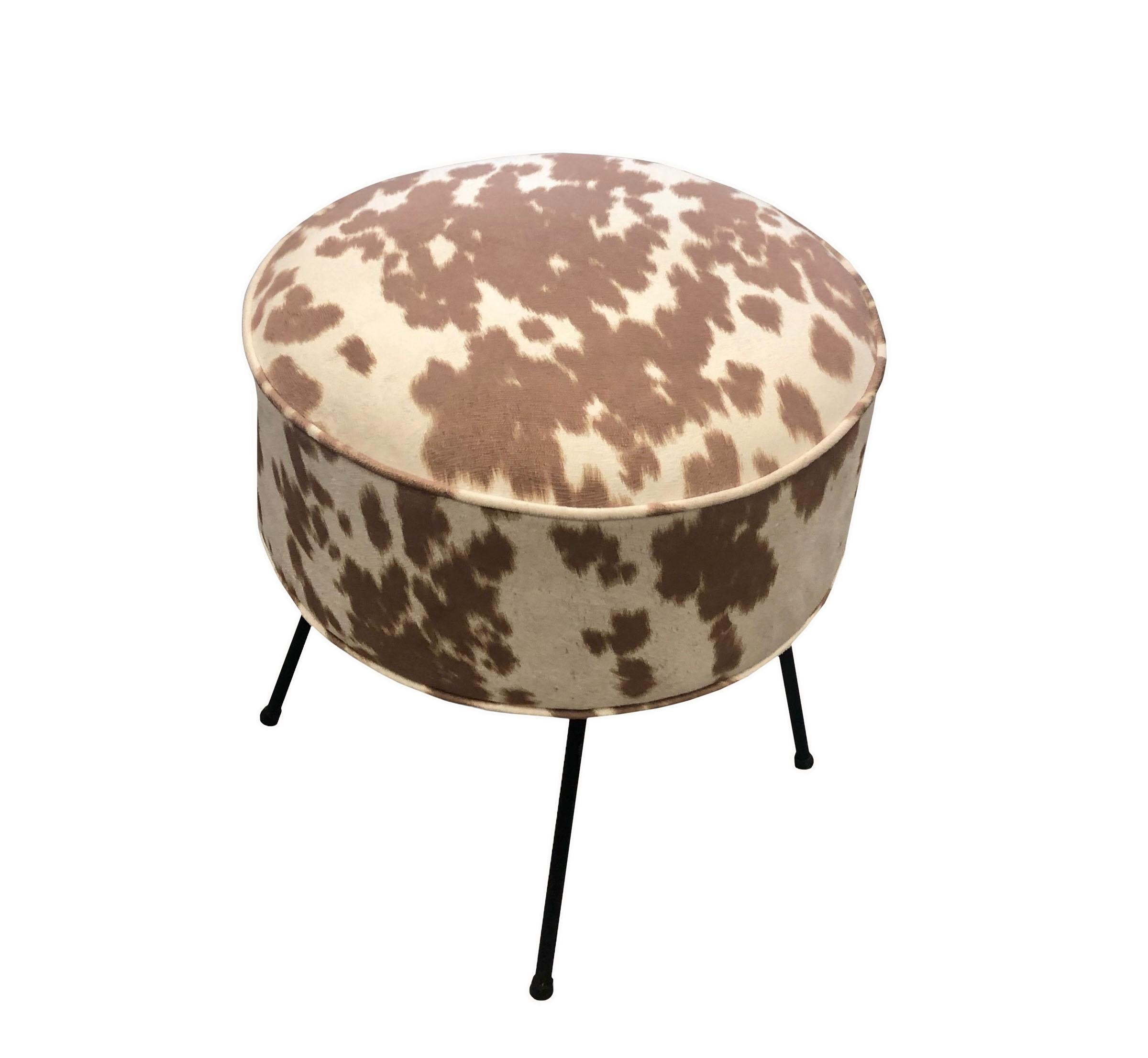 A round mid century stool with hairpin legs, circa 1950s. Upholstered in cowhide suede.
 
