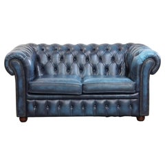 Cowhide leather Chesterfield 2-seater sofa in a jeans blue color