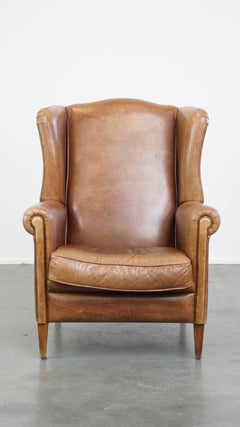 Sedia Wingback in pelle di vacchetta color cognac chiaro