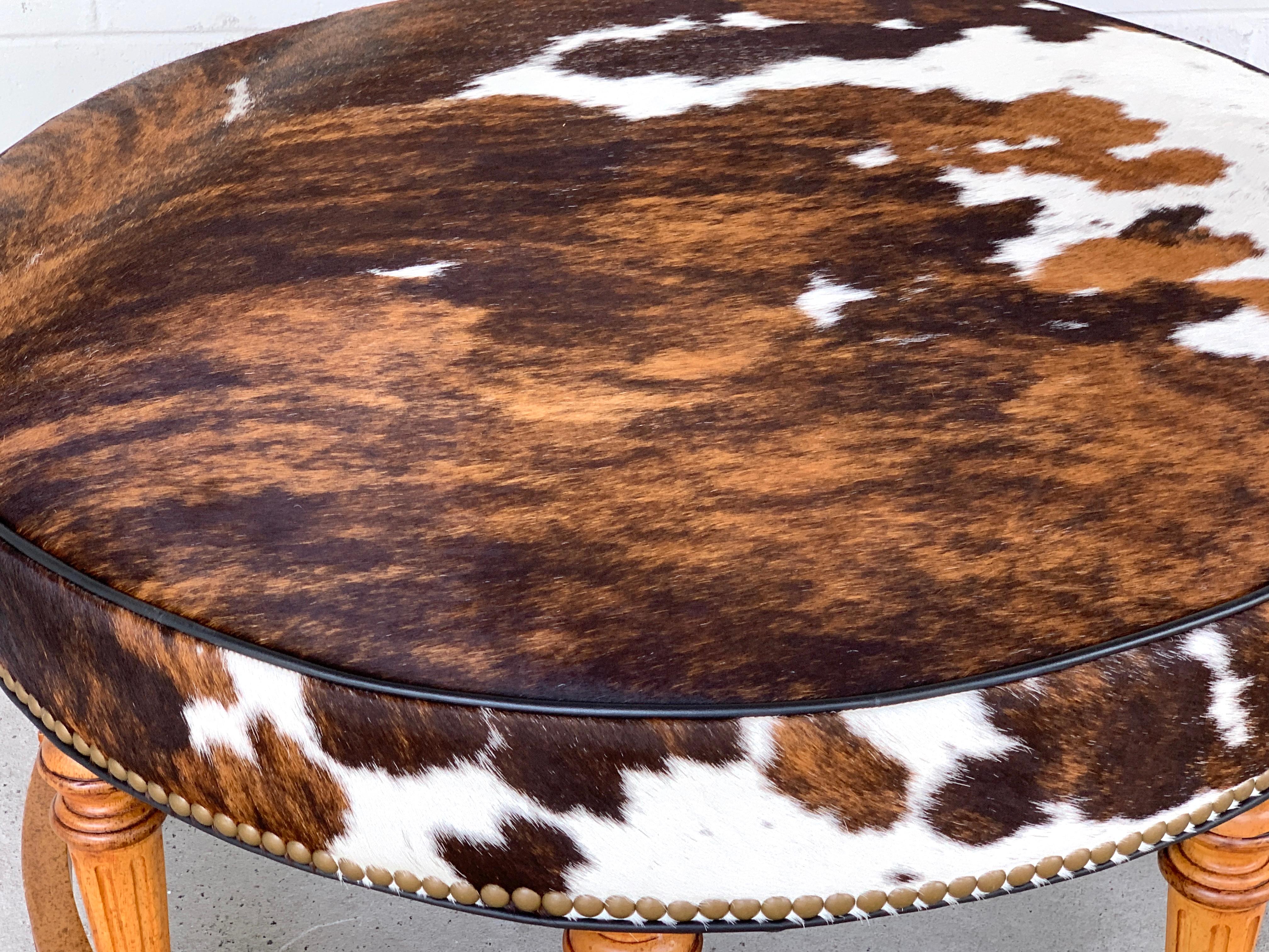 Carved Cowhide Ottoman by Hancock and Moore For Sale
