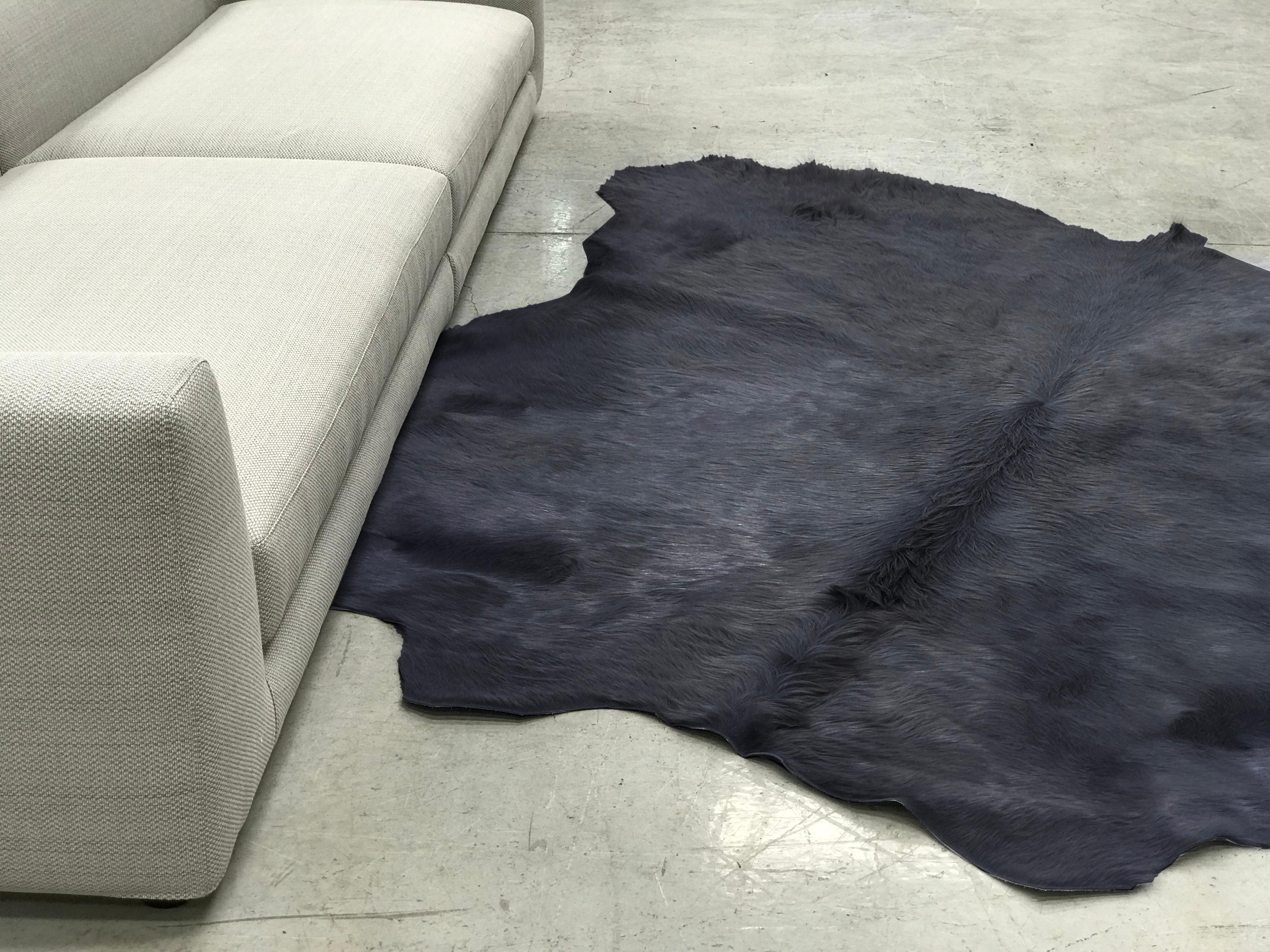 Cowhide rugs in Khaki, sustainably sourced and hand-dyed. 
Approximate dimensions: 230-260 x 230-260cm 
Six different colors: Salmon pink, burgundy, khaki, light grey, mid grey and black

Please note that color hues may vary from batch to batch