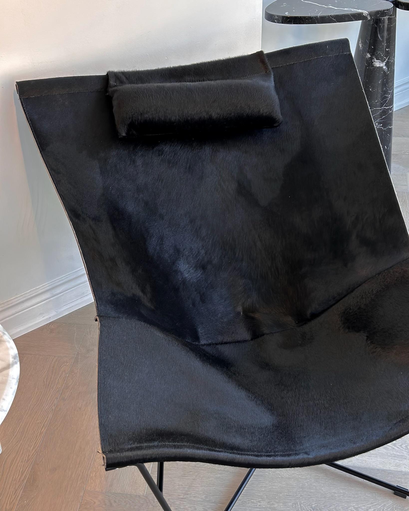 Excellent condition. Near flawless condition of cowhide sling with leather backings and matte black framing. Removable head cushion. Previous owner purchased from Paris years back; date unknown. A rare and coveted piece sure to remain timeless in