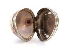 Cowrie shell snuff box with flaming-heart silver relief, George II period