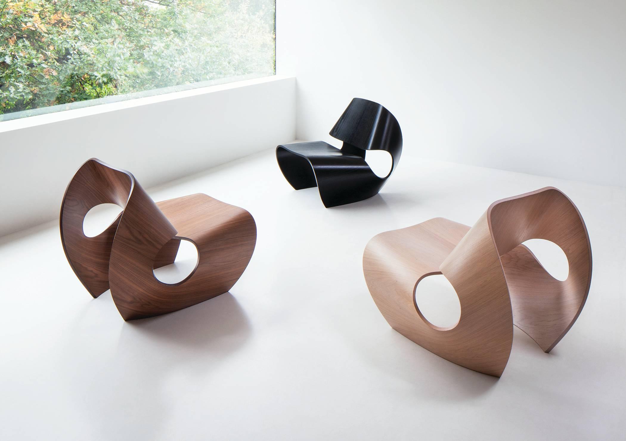 The contemporary Cowrie chair is a rock solid easy chair inspired by the concave lines of sea shells. The curvilinear forms are the result of an extensive research and innovation process that bridges the handmade with the digital. Sweeping lines are