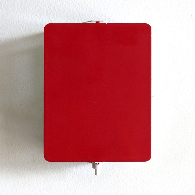 Iconic enameled wall lights by Charlotte Perriand with adjustable reflectors in rare red finish, optional horizontal or vertical mount, manufactured and distributed by Steph Simon, Paris, marked, wired for US standards, one E12 socket, max. wattage