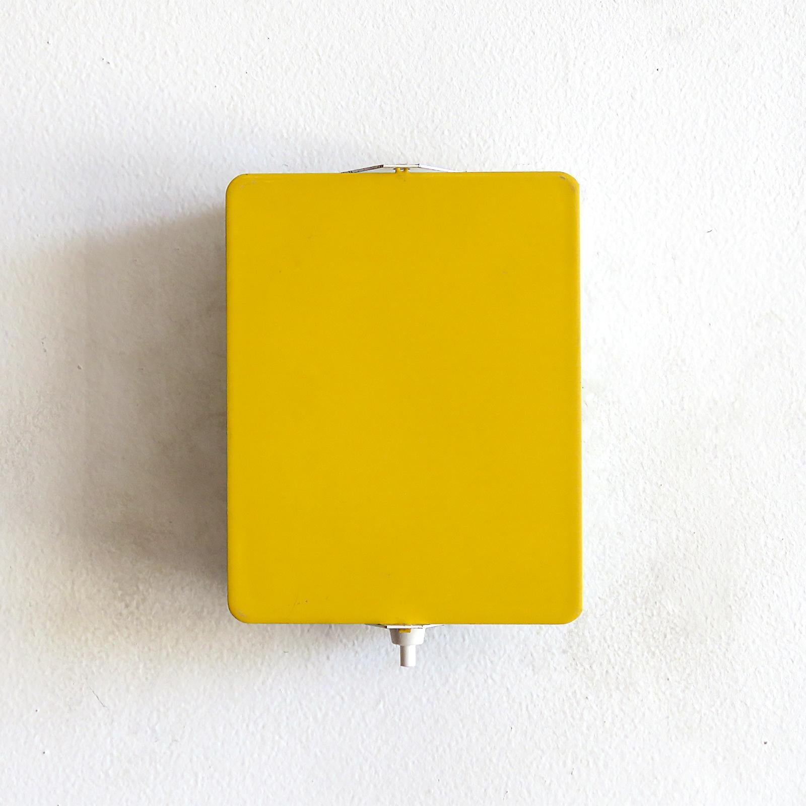 Iconic enameled wall lights by Charlotte Perriand with adjustable reflectors in rare yellow finish, optional horizontal or vertical mount, manufactured and distributed by Steph Simon, Paris, marked. Wired for US standards, one E12 sockets each, max.