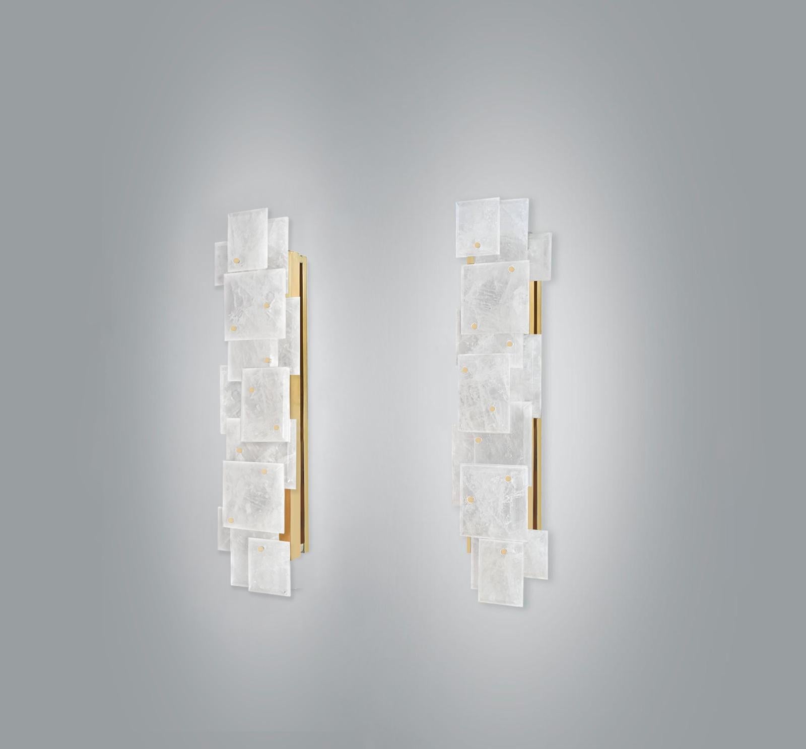 Pair of modern rock crystal quartz sconces with multiple panels decorations in polished brass finish. Created by Phoenix Gallery.
Each sconce installed four sockets, use four 75 watts Led warm light bulbs, 300watts total. Light bulbs supplied.