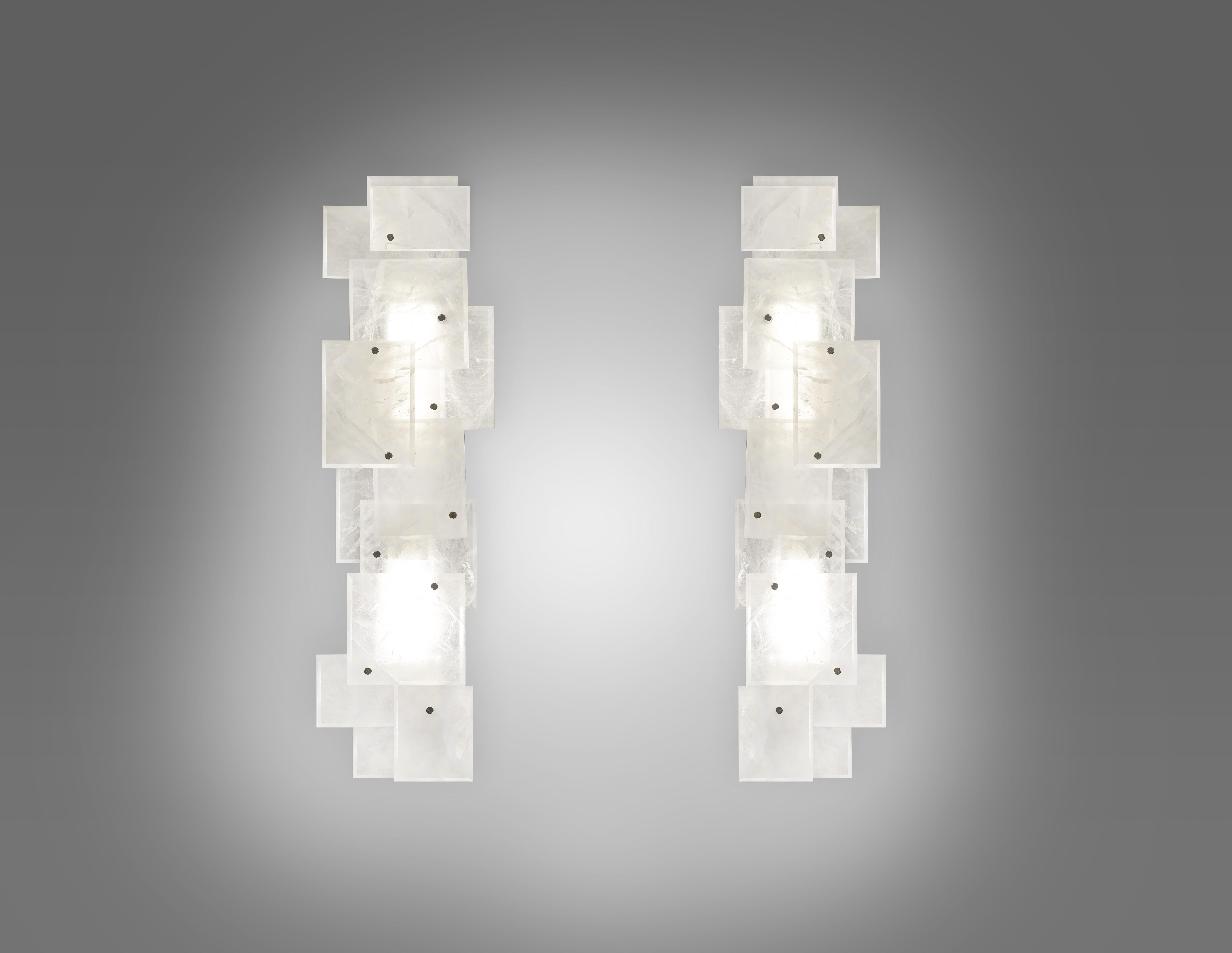 Single modern rock crystal quartz sconces with multiple panels decorations in matt nickel finish. Created by Phoenix Gallery.
Each sconce has two sockets, use LED, long tube, warm lights.
Four 60 watts LED, warm lights are included.