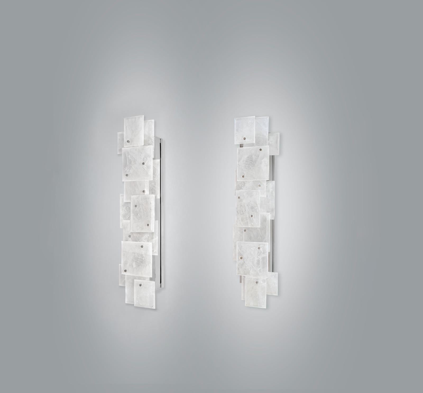 Pair of modern rock crystal quartz sconces with multiple panels decorations in matte nickel finish. Created by Phoenix Gallery.
Each sconce installed four sockets, use four 75 watts Led warm light bulbs, 300watts total. Light bulbs supplied.
  