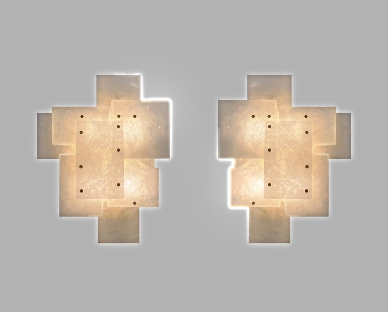 Pair of modern rock crystal quartz sconces with multiple panels decorations in polished brass finish. Created by Phoenix Gallery. Each sconce installed four sockets, use four 75 watts Led warm light bulbs, 300watts total. Light bulbs supplied.