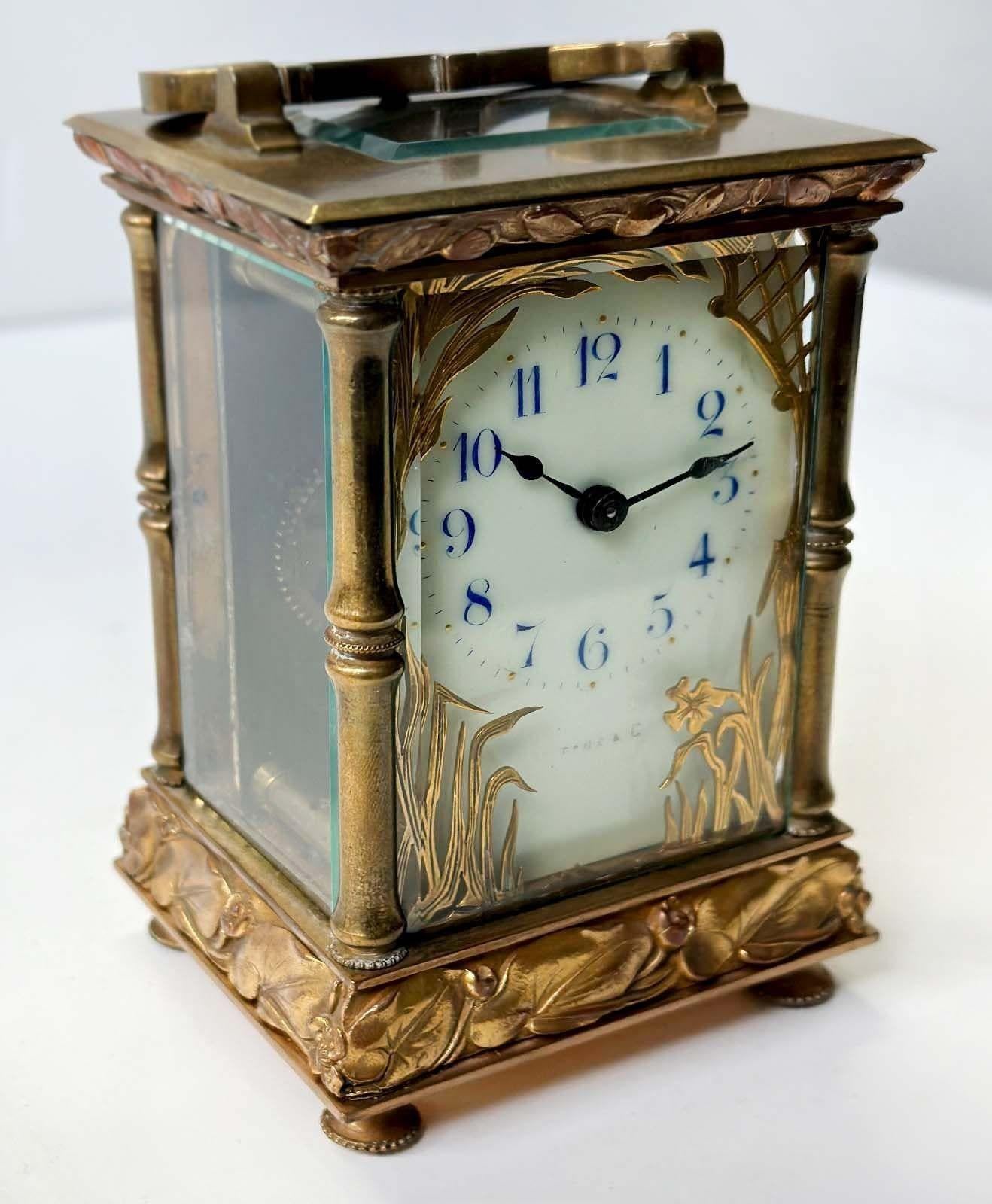 Lovely brass and glass carriage clock by C.R. Crookshank for Tiffany & Co. Made in France in the 20th century. Adorned with endearing botanical and floral motifs all around the piece.
Delicately marked Tiffany & Co. (though slightly faded) and