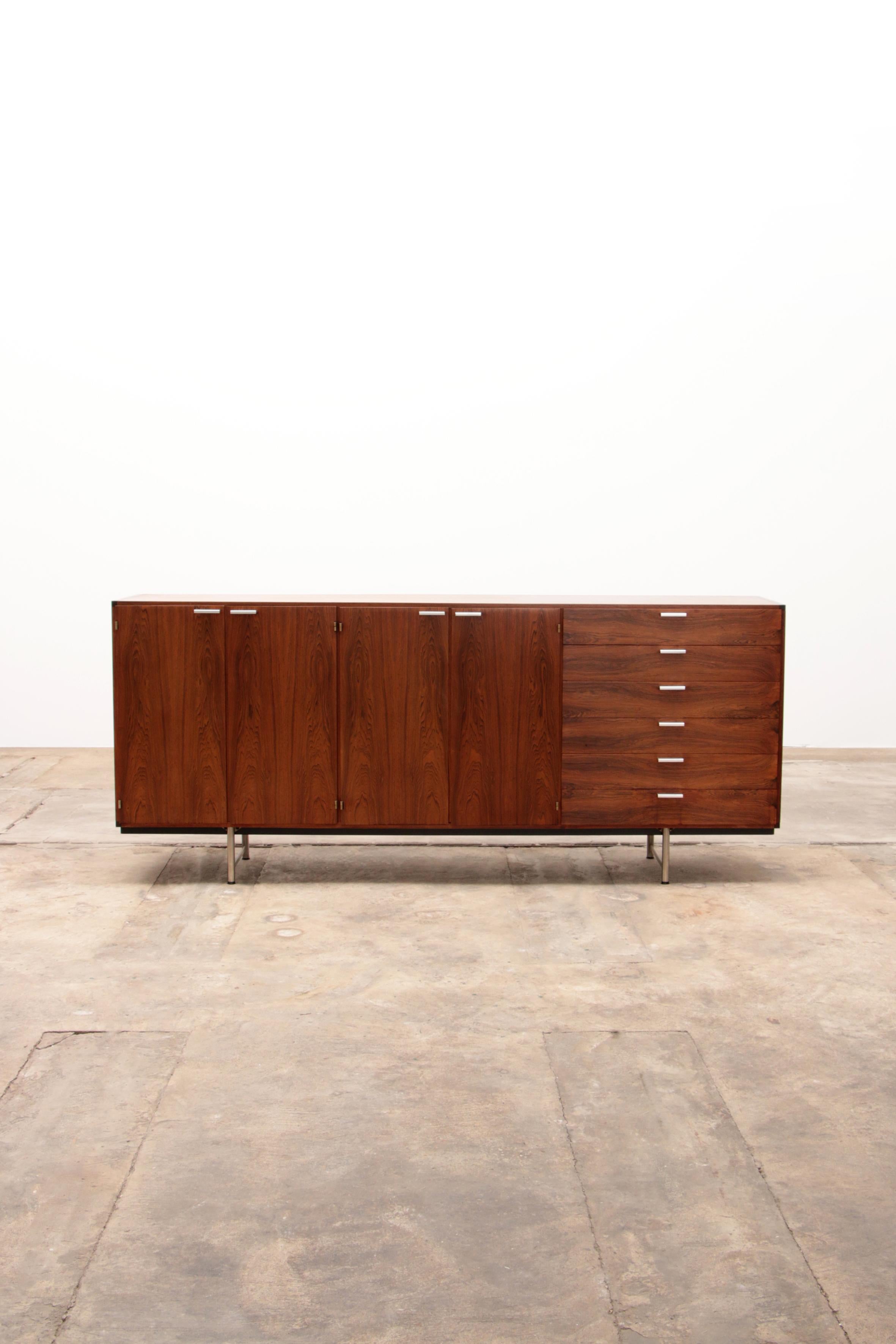 Rare Pastoe sideboard designed by Cees Braakman in the 1960s. The sideboard is made of wenge wood and stands on a sleek metal base. This version contains six drawers, four doors and 6 shelves. The top two drawers contain crockery holders and the