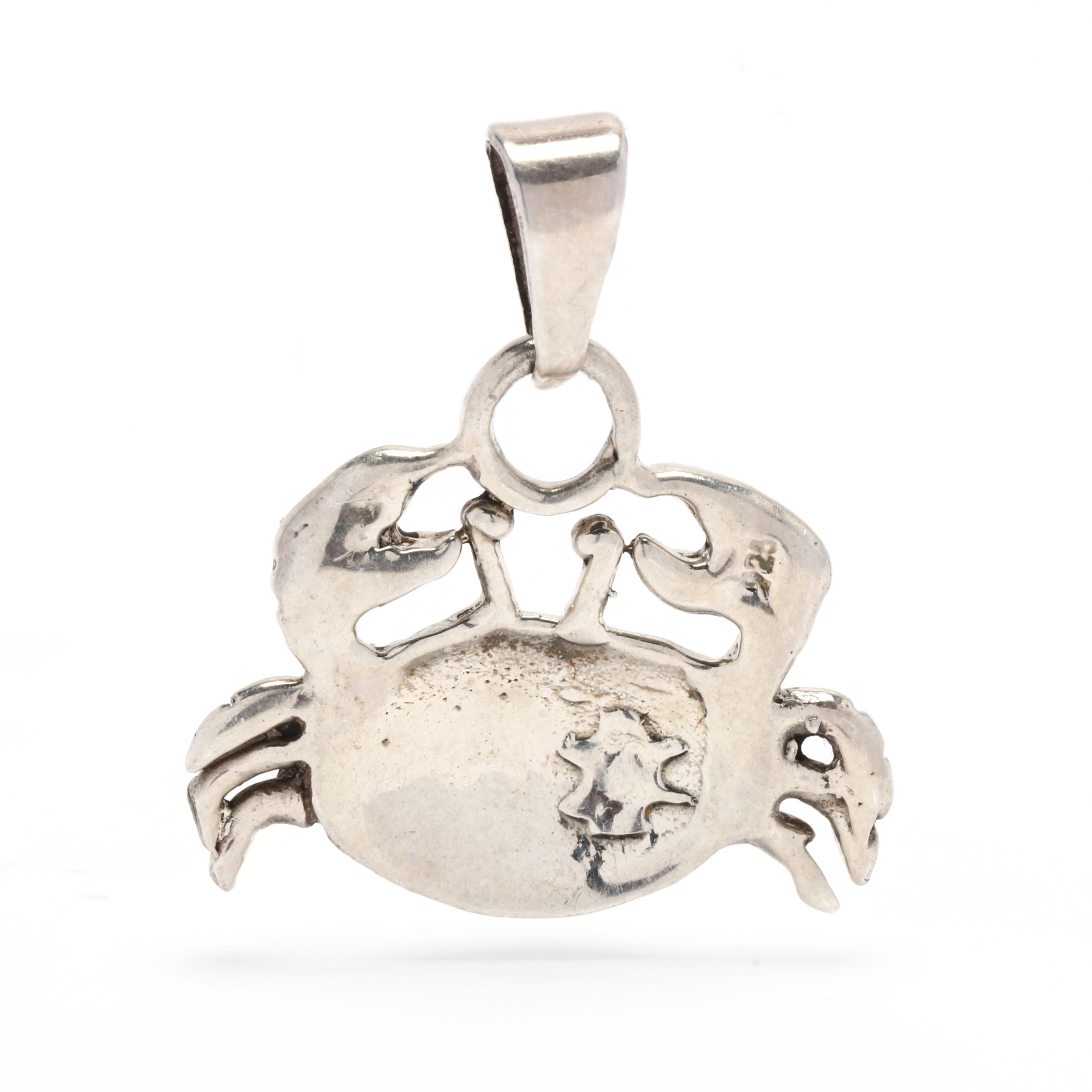This gorgeous sterling silver crab pendant is the perfect addition to any outfit! Crafted in Massachusetts, it measures 1.25 inches and comes with a sterling silver chain. This pendant is perfect for a special occasion, or to add a touch of coastal