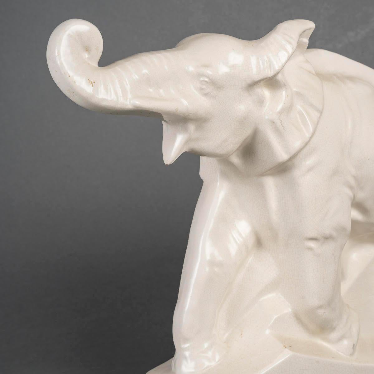 Cracked earthenware sculpture, signed LEJAN, the elephant Dolly, circa 1930.

An Art Deco period cracked earthenware sculpture, 1930, signed LEJAN, depicting an elephant Dolly.
H: 30cm, W: 37cm, D: 13cm