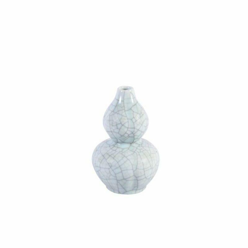 Crackle Celadon porcelain bud vases - Set of 3

Shape: Mini Vase
Color: Celadon
Size (inches): 7W x 7D x 11H (Each. Approximately)
Total Weight: 17lbs

High fire porcelain, 100% hand-shaped, hand-painted. Distress, chips and other