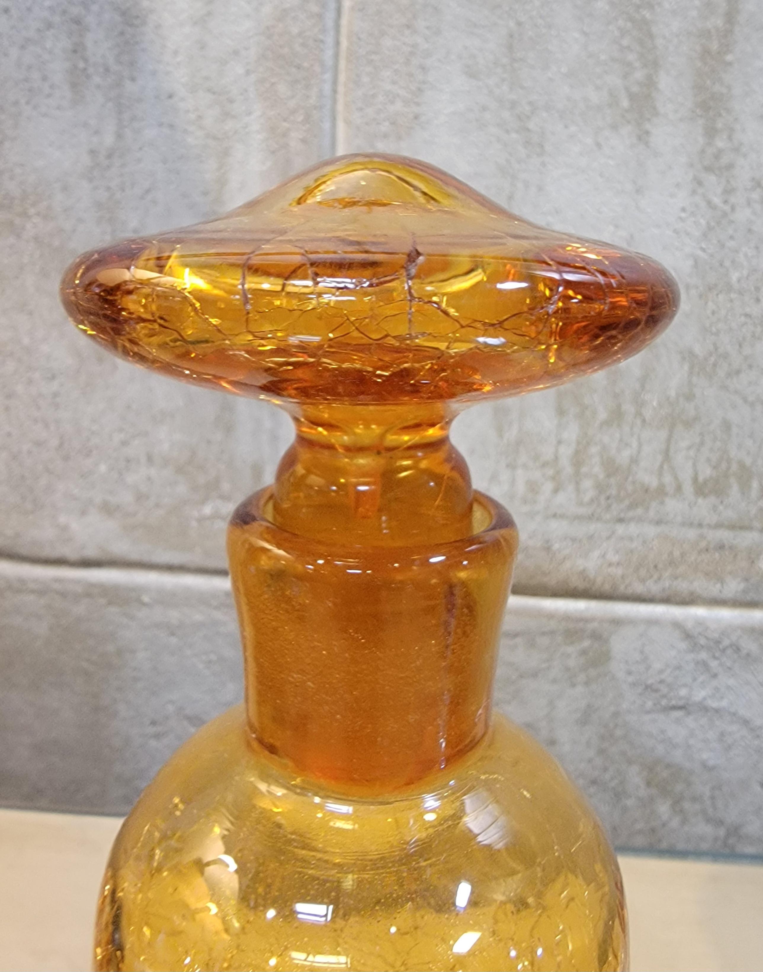 Yellow or citrine blown crackle glass decanter with stopper. Made in the manner of the 1960's art glass makers of the mid-century period, Viking, Blenko, Pilgrim, etc. Measures 9.25 inched high. Circa. 1960's.