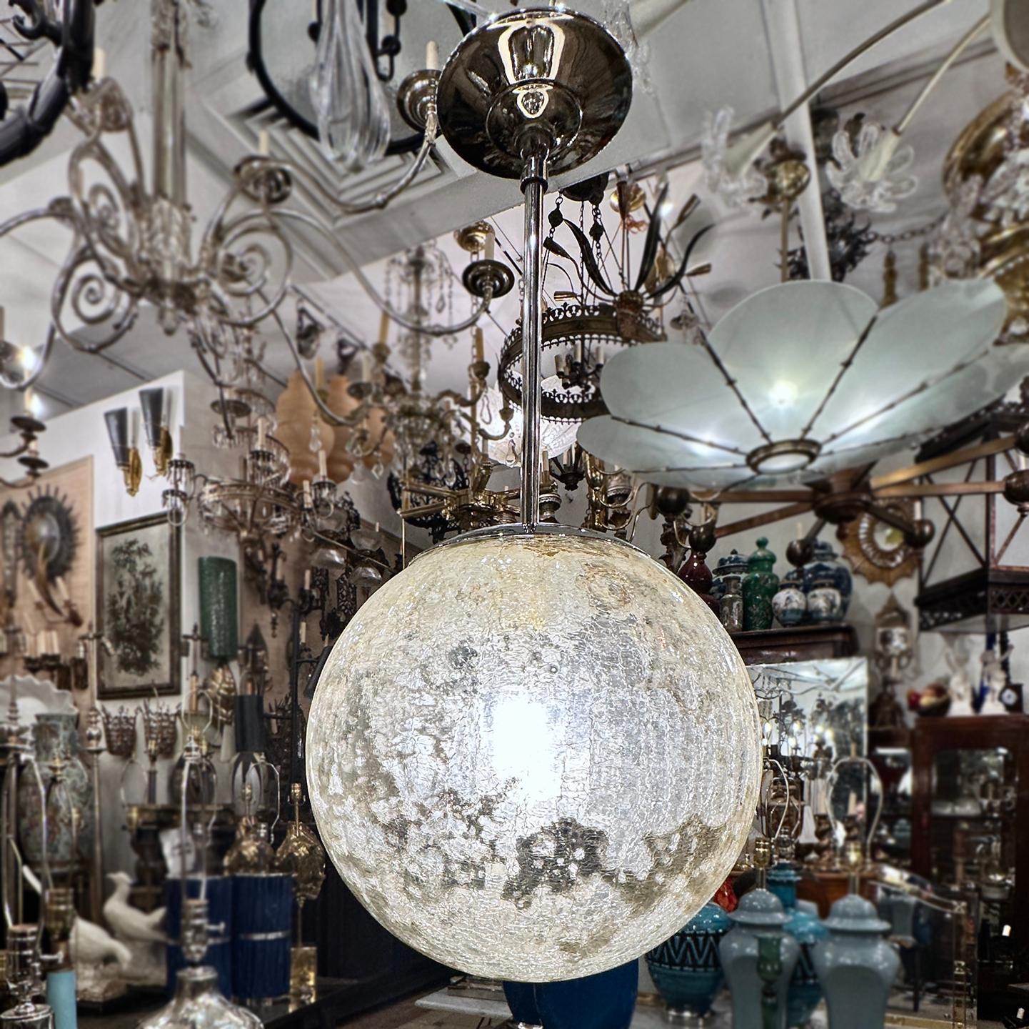A circa 1960's Italian crackled and mirrored globe light fixture.

Measurements:
Current drop: 22