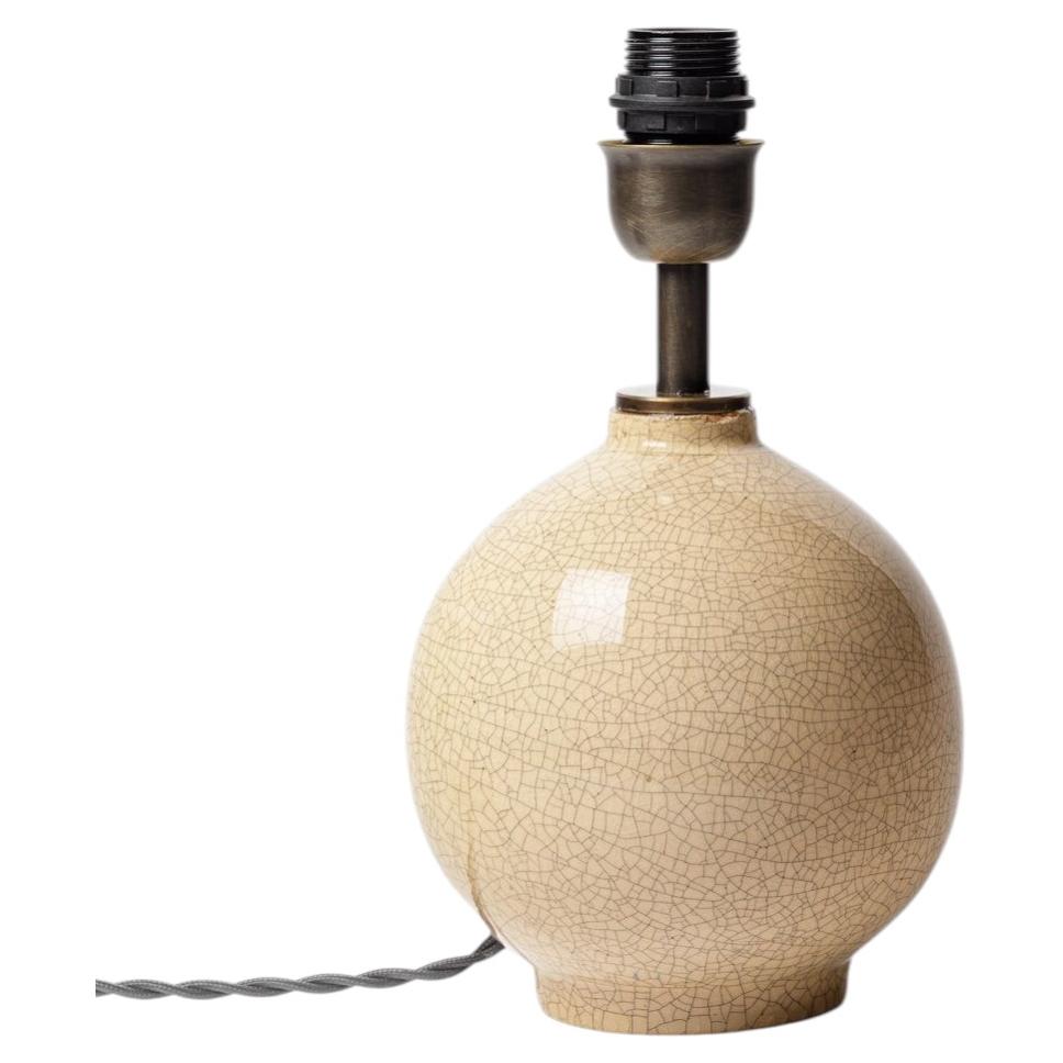 Crackled-glazed earthenware table lamp by Jean Maubrou, circa 1940.
