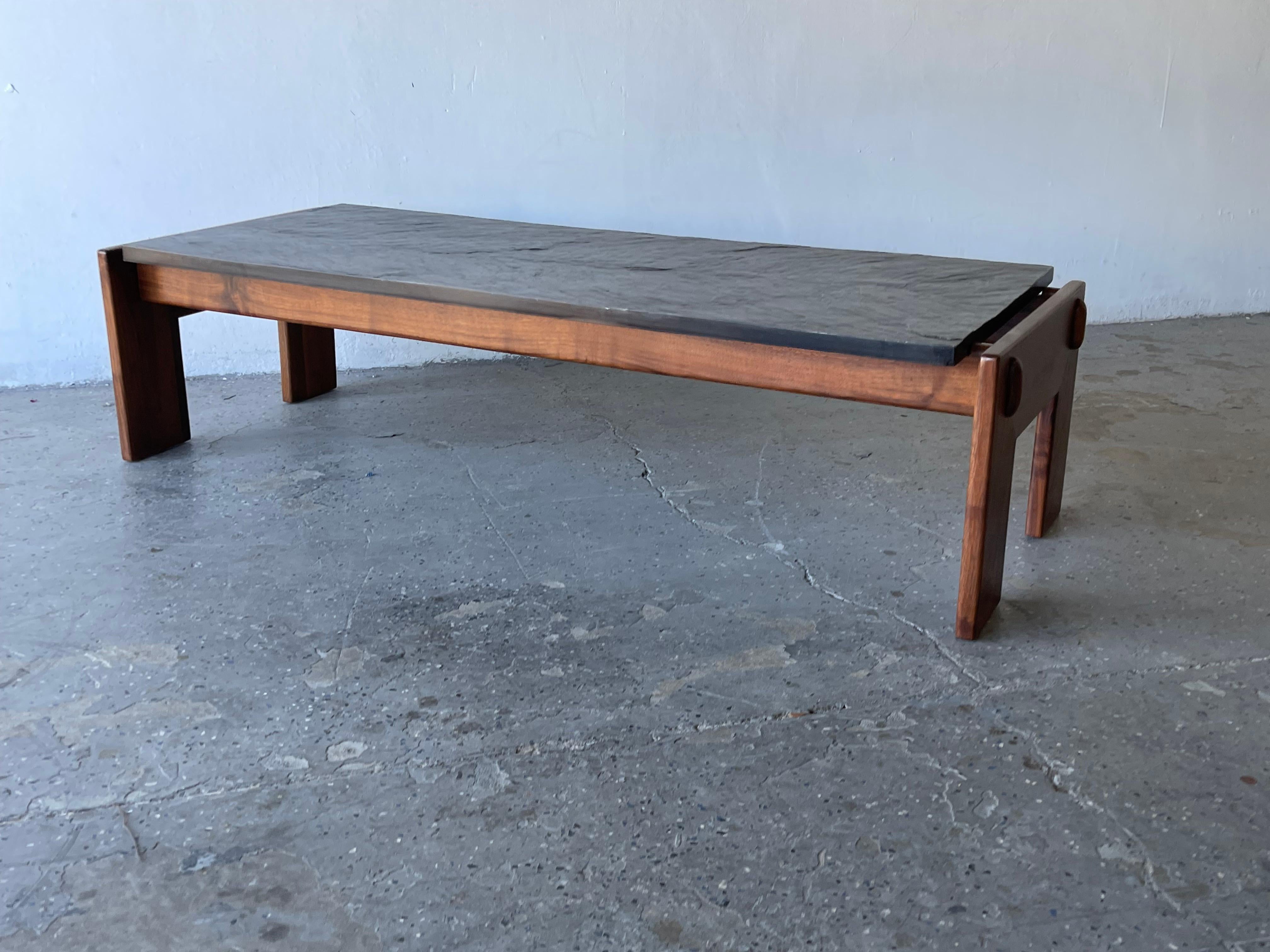 This Adrian Pearsall brutalist low table, crafted from walnut with a top of slate, was made for Craft Associates and is indicative of Pearsall’s talent. The slate and walnut low table in its simplicity is a mid century masterpiece.


The slate