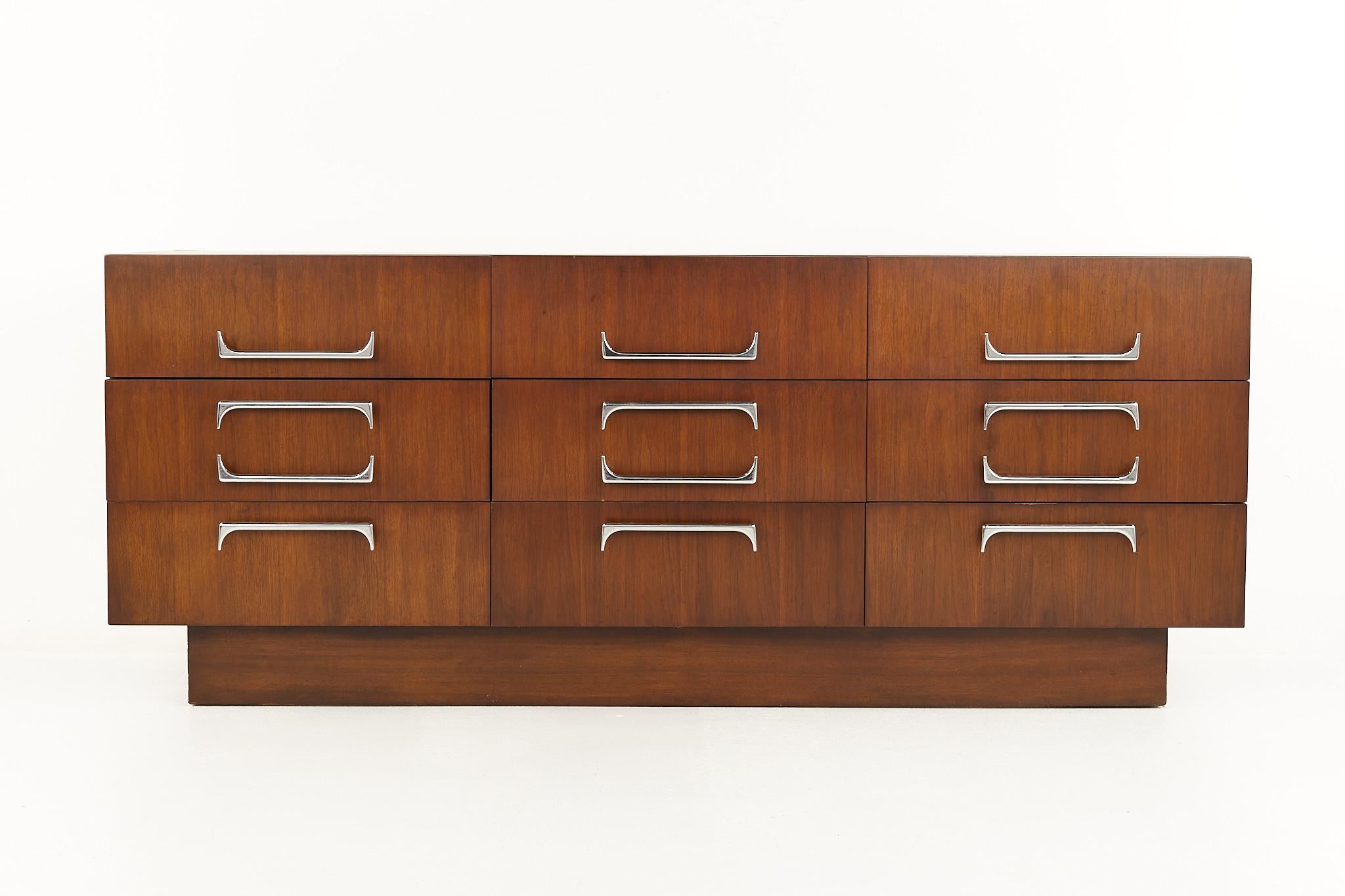 Craft Associates Mid century walnut and chrome 9 drawer lowboy dresser

This dresser measures: 72 wide x 19.25 deep x 29.25 inches high

All pieces of furniture can be had in what we call restored vintage condition. That means the piece is